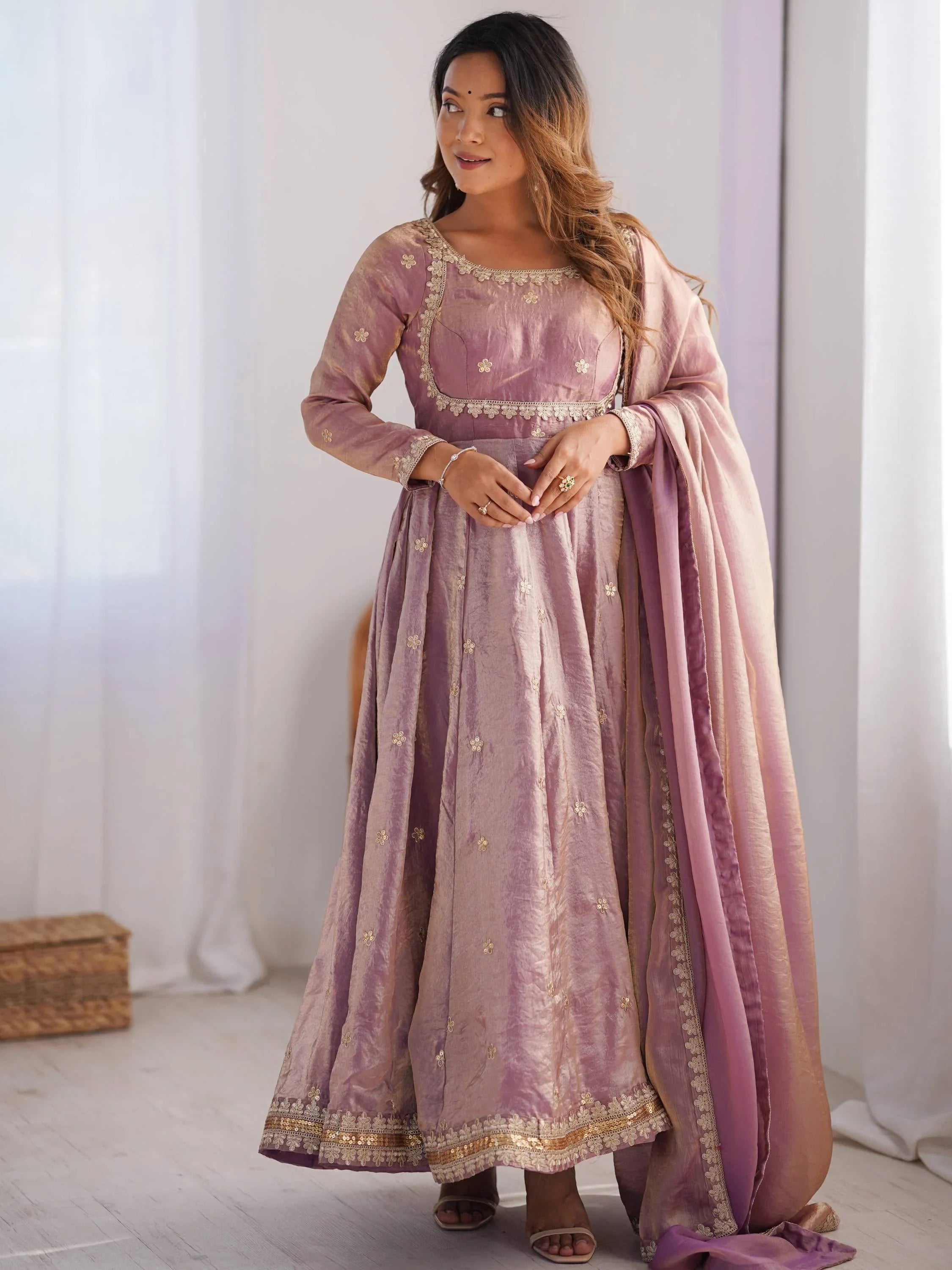 Woman in elegant pink embroidered Anarkali dress with dupatta, Indian ethnic wear fashion