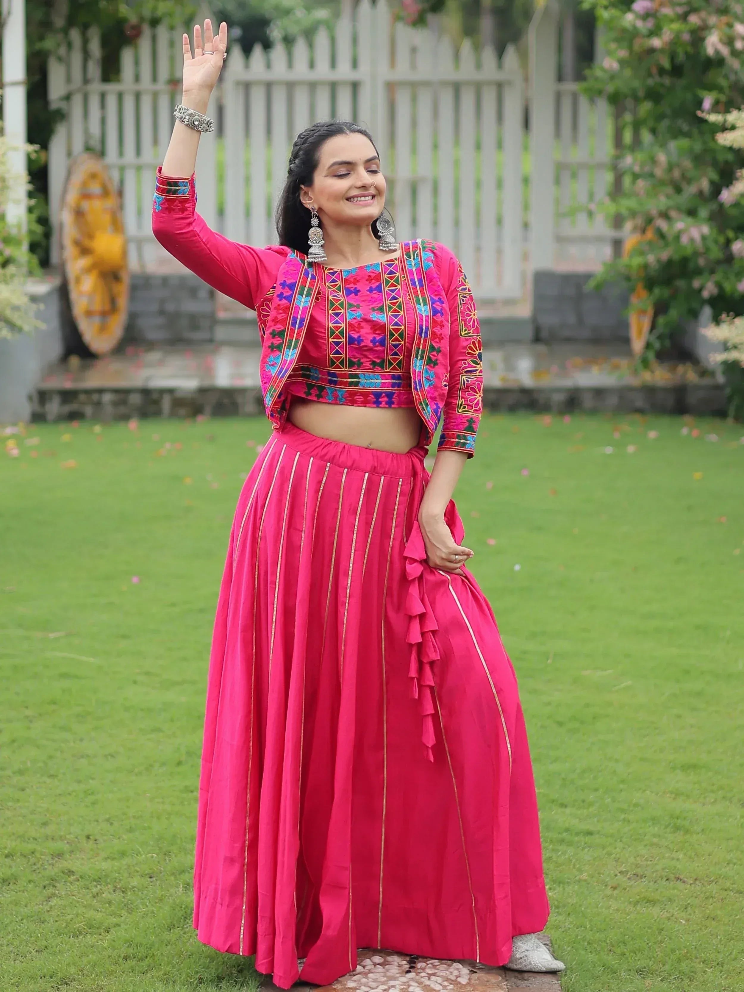 Pink embroidered lehenga choli with ruffle skirt, perfect for Indian ethnic wear and festive occasions