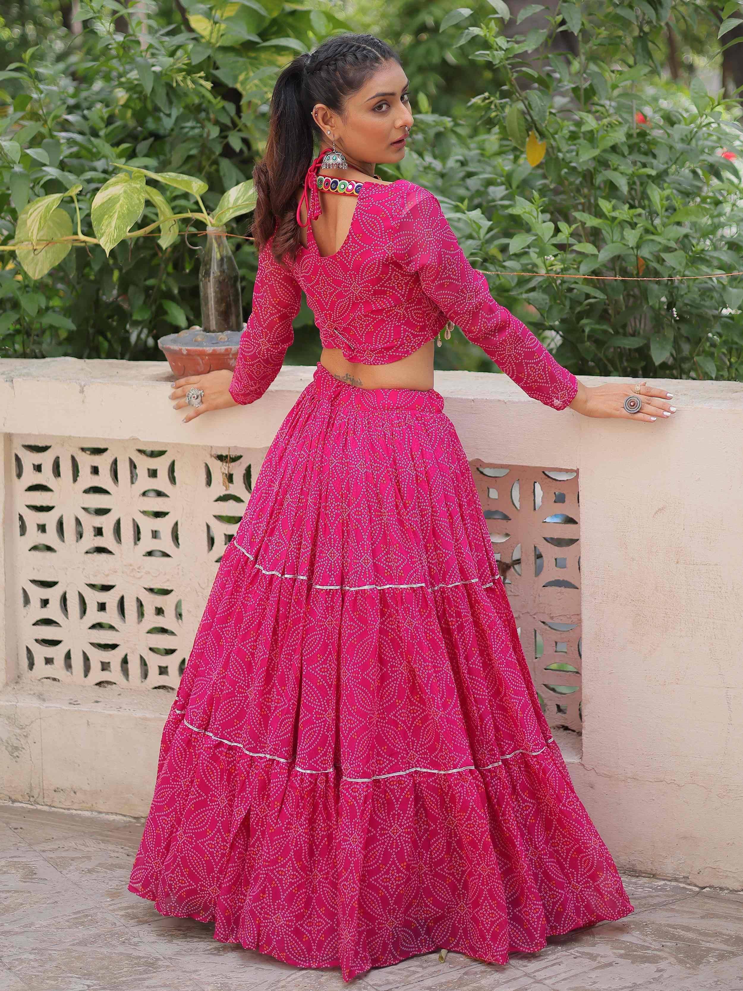 Pink printed lehenga choli with long sleeves and back cutout, perfect for ethnic occasions