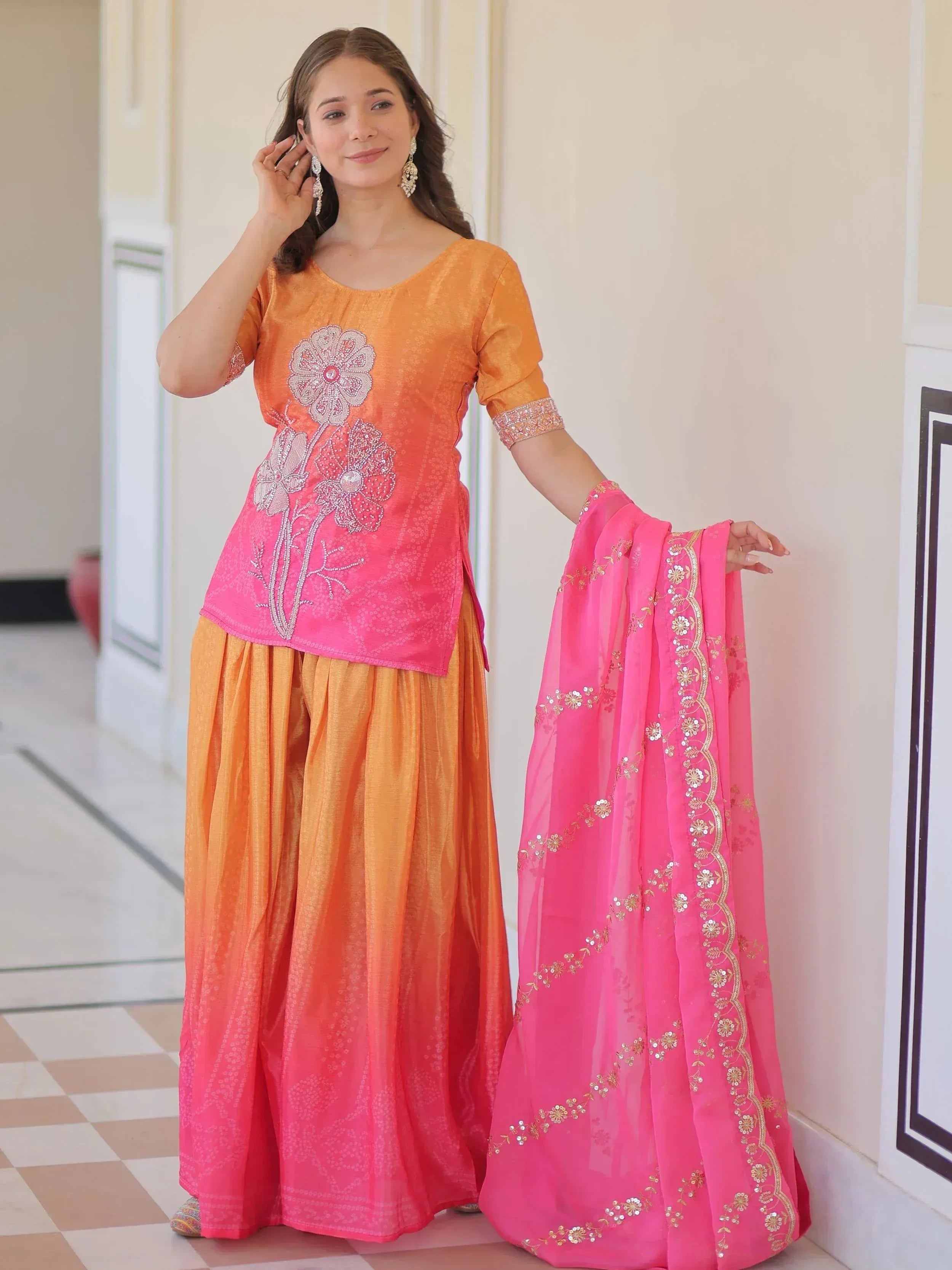 Orange and pink embroidered salwar kameez with floral design and matching dupatta for ethnic wear
