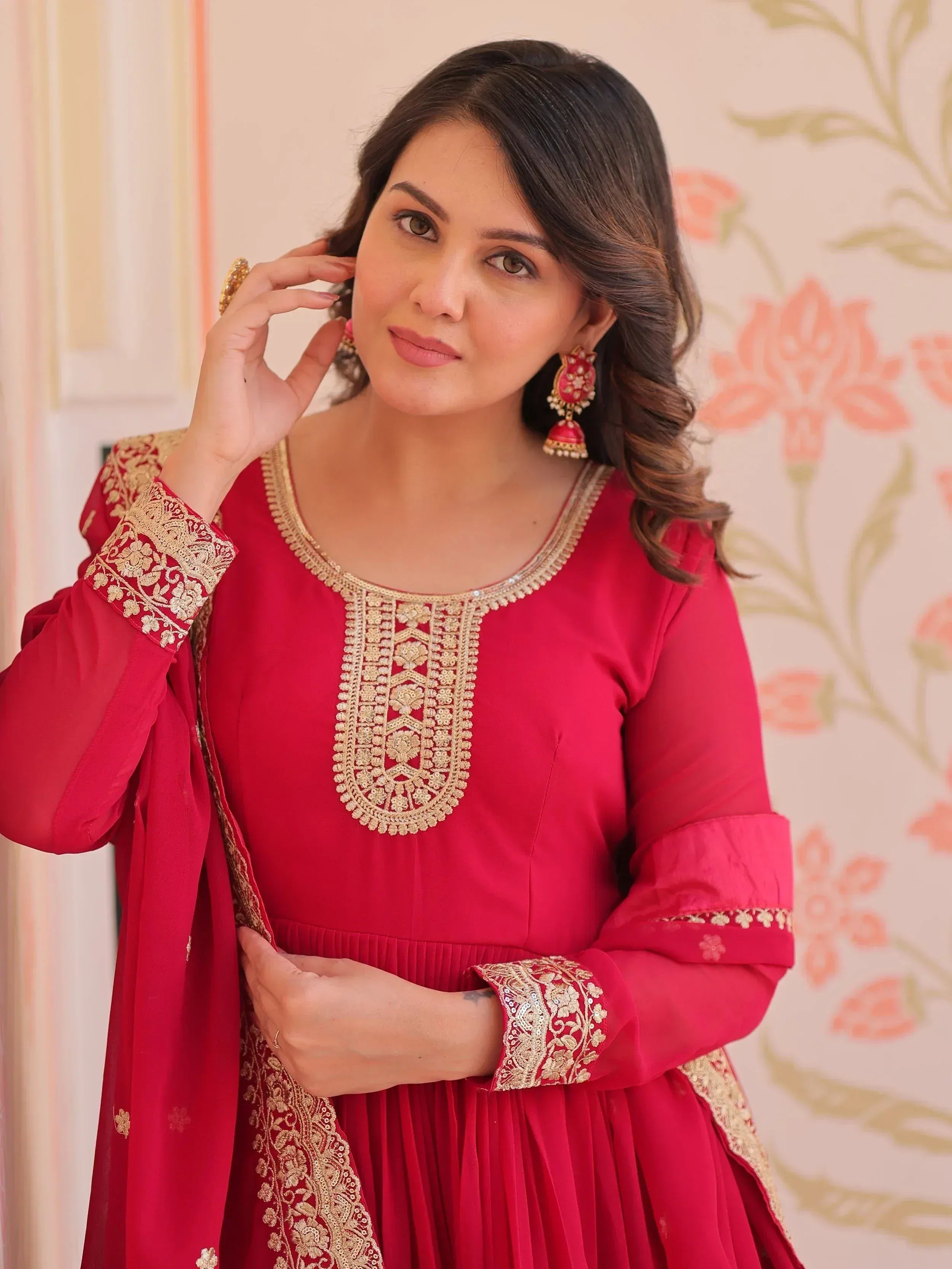 Red ethnic gown with gold embroidery, perfect for Indian occasions and festive wear
