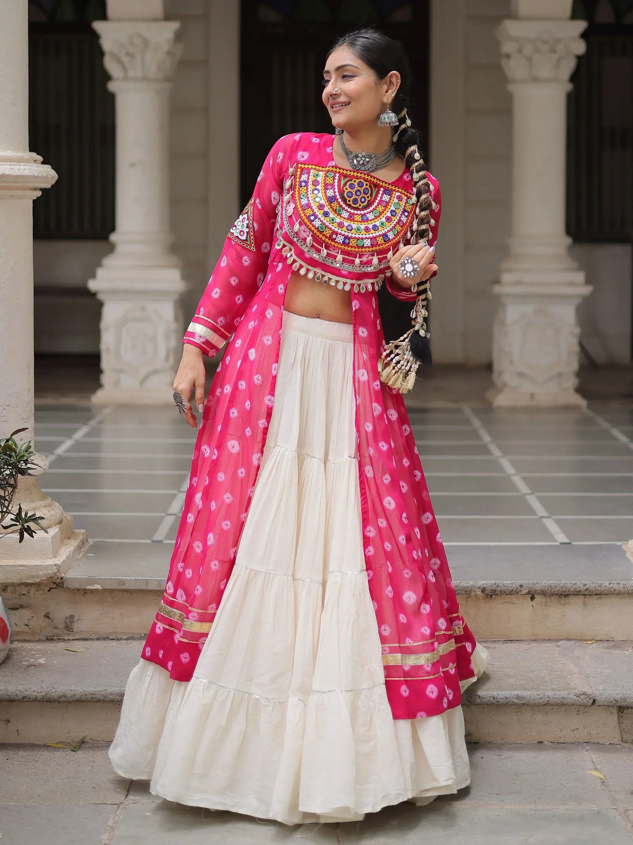 Pink and cream embroidered lehenga choli with mirror work, perfect for Indian ethnic wear occasions.