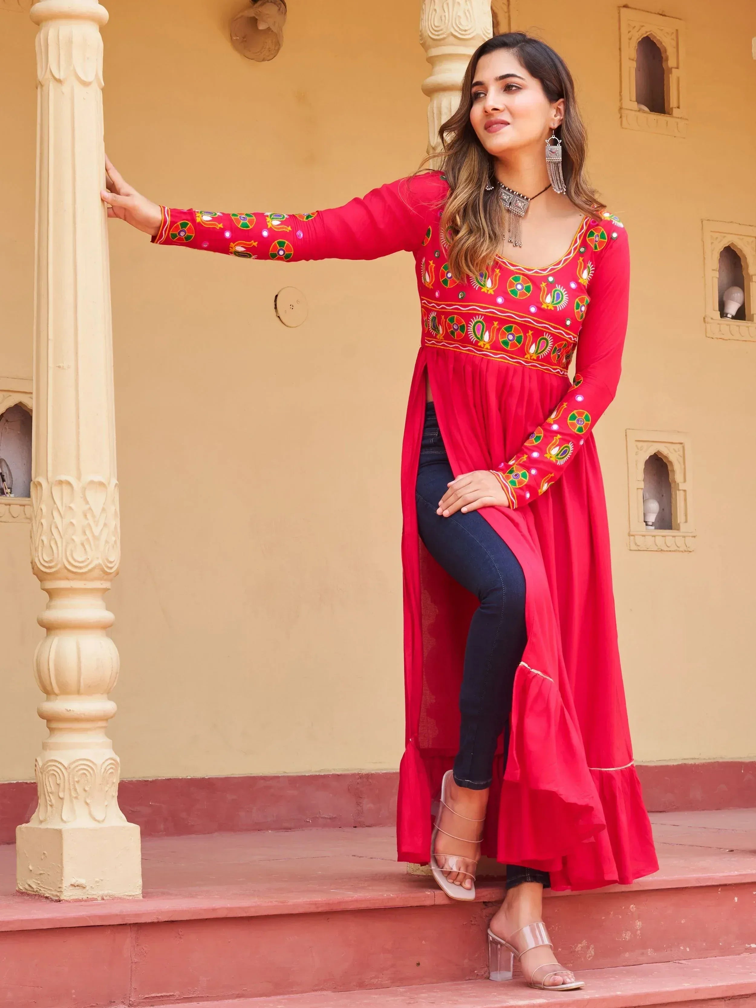 Red embroidered ethnic kurti with jeans, perfect for Indian fashion lovers