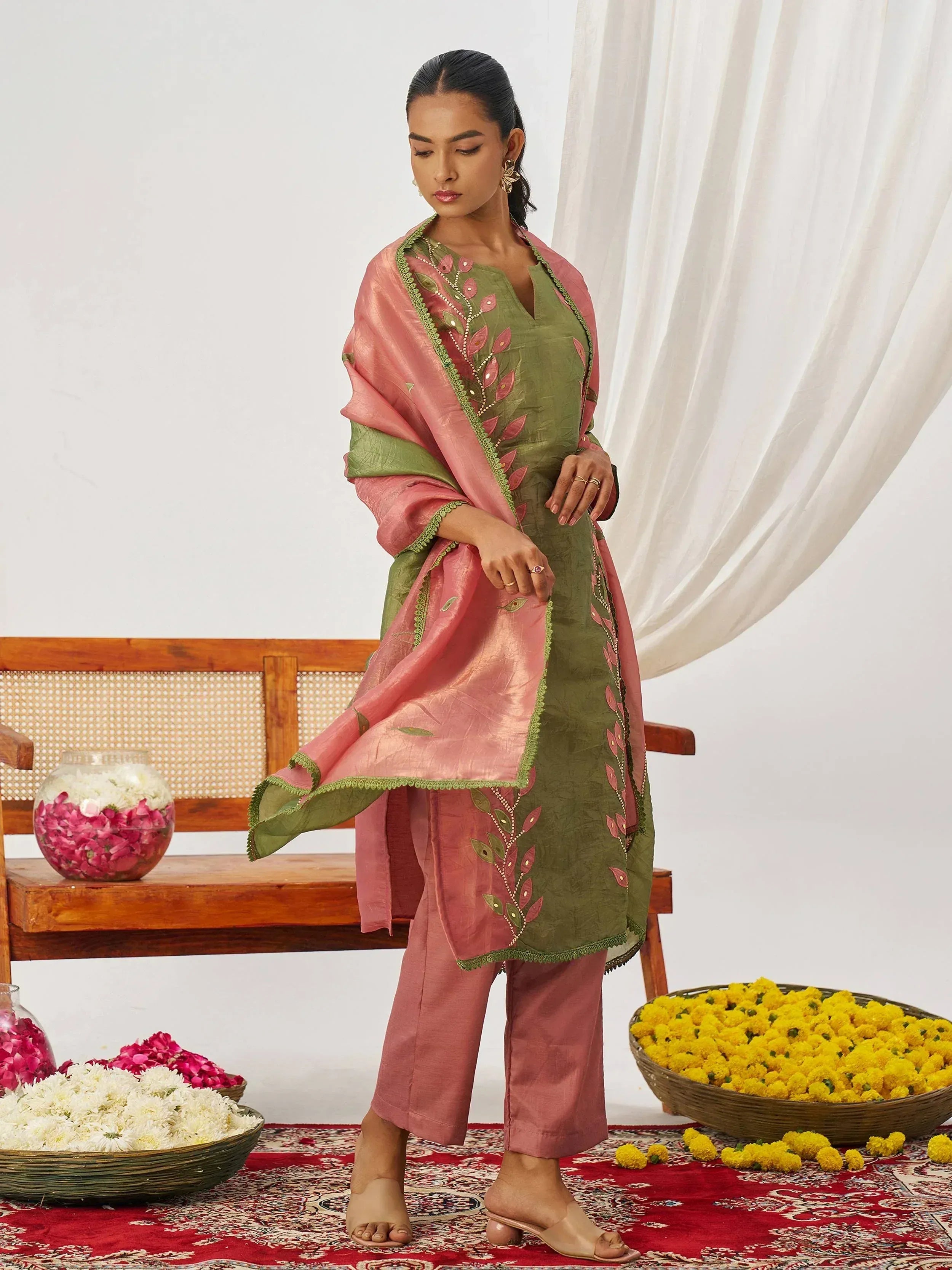 Green and pink embroidered salwar kameez with floral dupatta, perfect for Indian ethnic wear occasions
