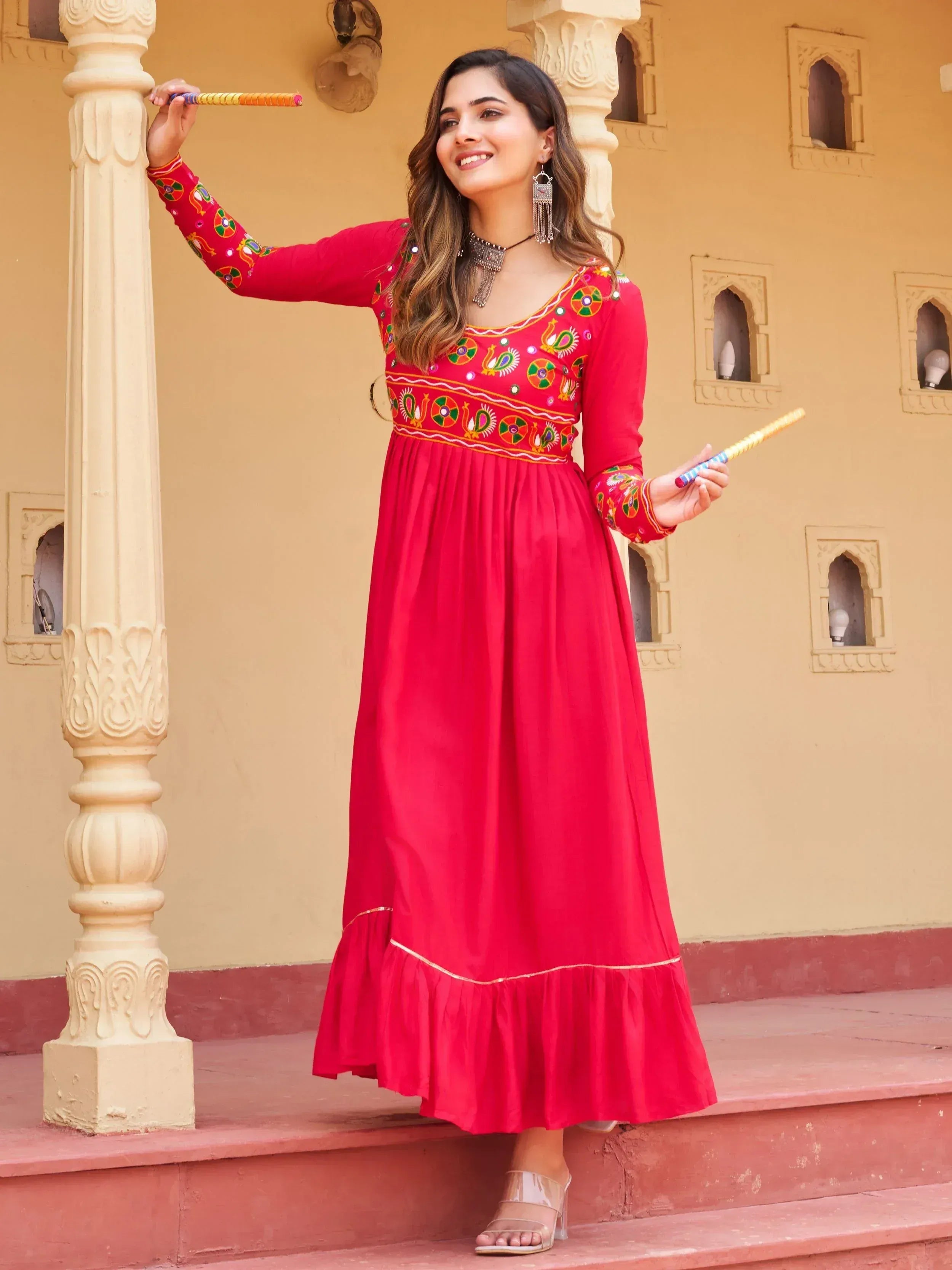 Red embroidered ethnic gown with peacock motifs, perfect for festive occasions