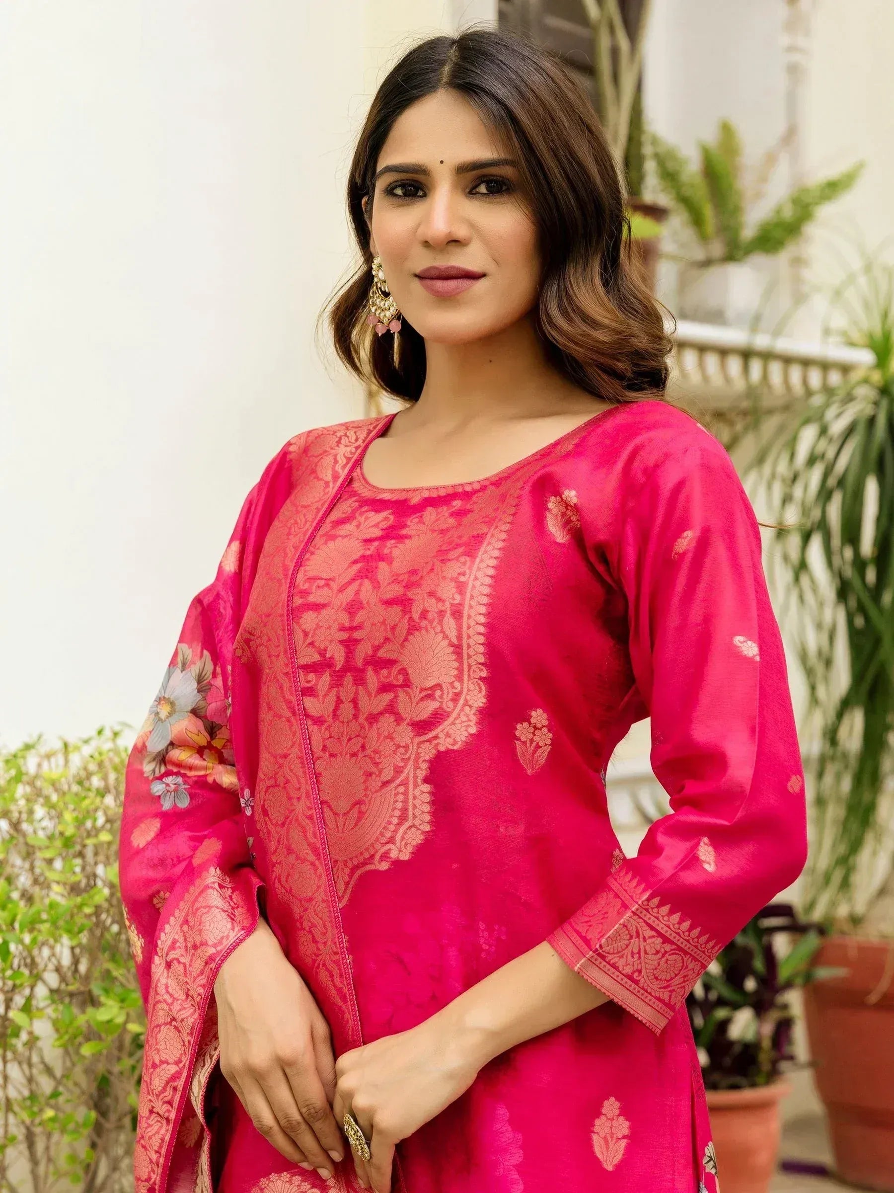 Pink designer salwar kameez with floral embroidery and gold detailing, perfect for ethnic occasions
