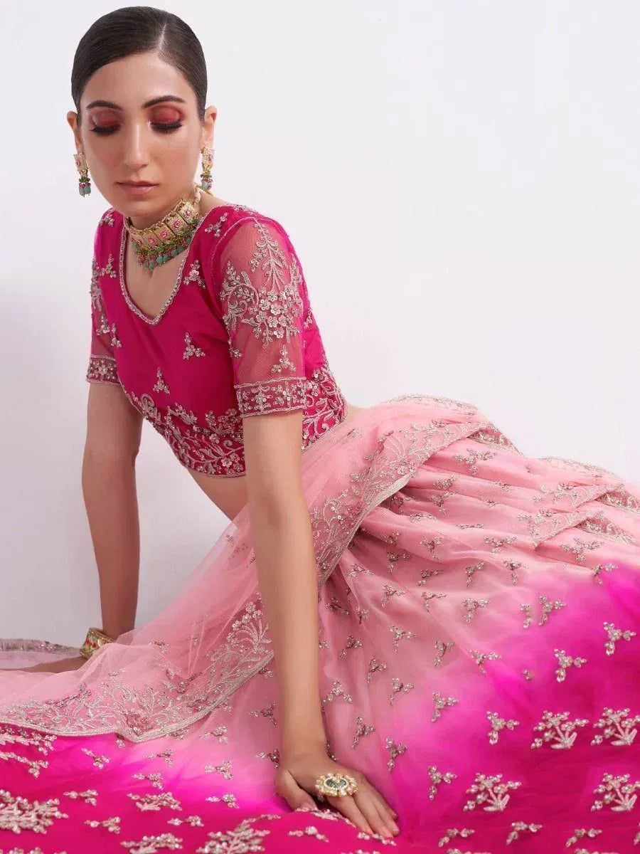 Pink ombre lehenga choli with silver embroidery, perfect for Indian weddings and festive occasions