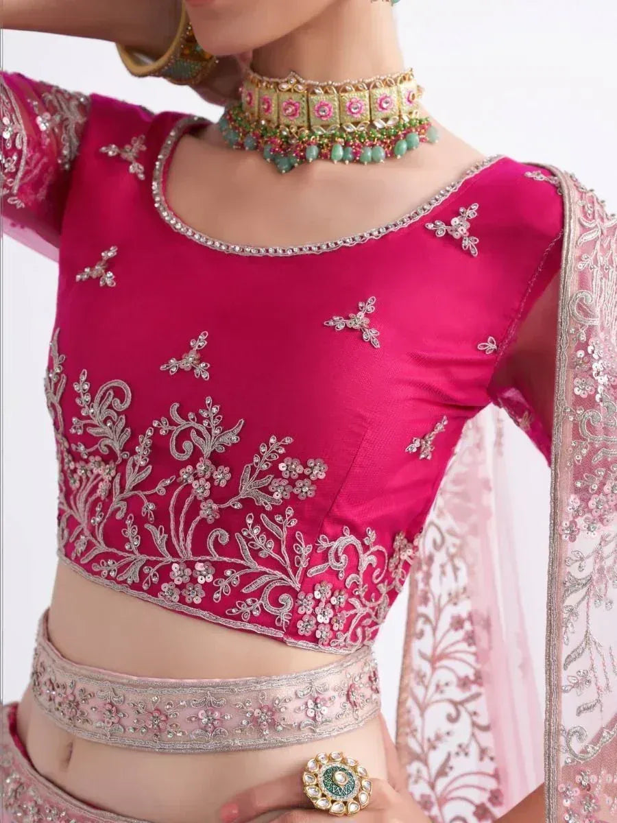 Pink embroidered lehenga choli with floral zari work, matching dupatta, and traditional jewelry