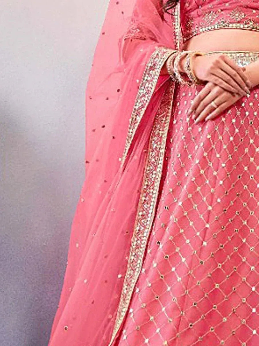 Pink designer lehenga choli with gold embroidery and mirror work, perfect for Indian ethnic wear