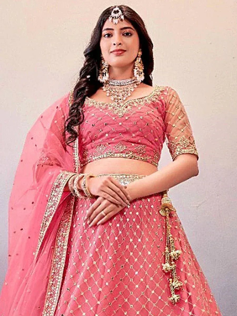 Pink designer lehenga choli with gold embroidery, perfect for weddings and festive occasions
