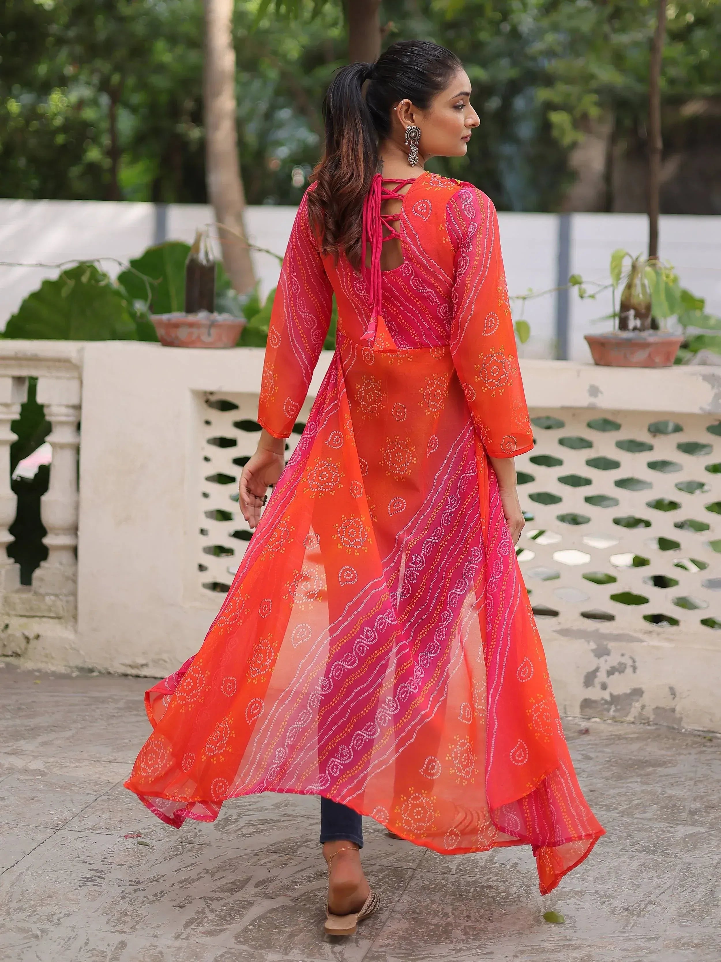 Orange and pink printed ethnic gown with back tie detail, perfect for Indian wear