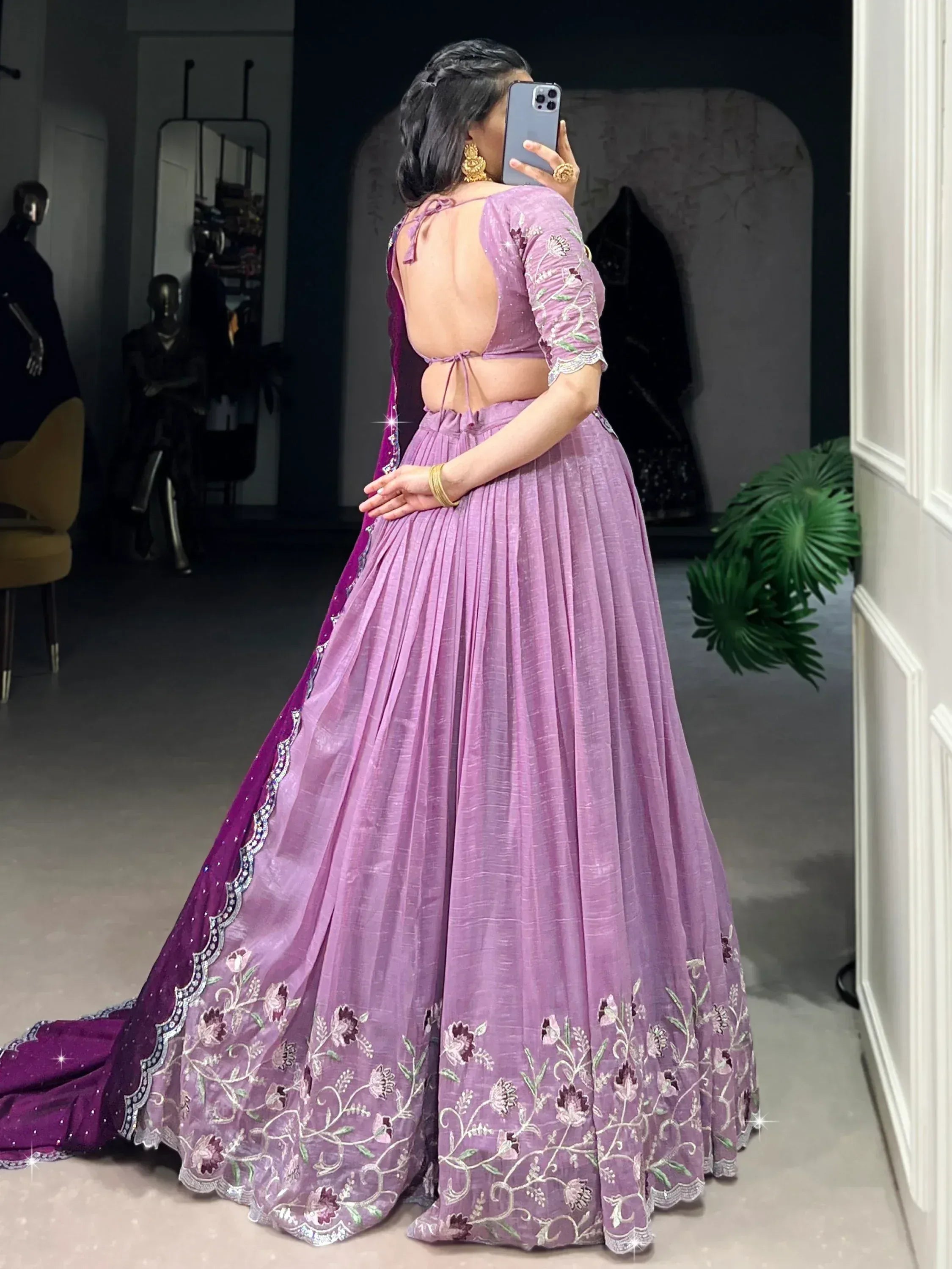 Purple embroidered lehenga choli with open back, floral detailing, and matching dupatta for Indian ethnic wear