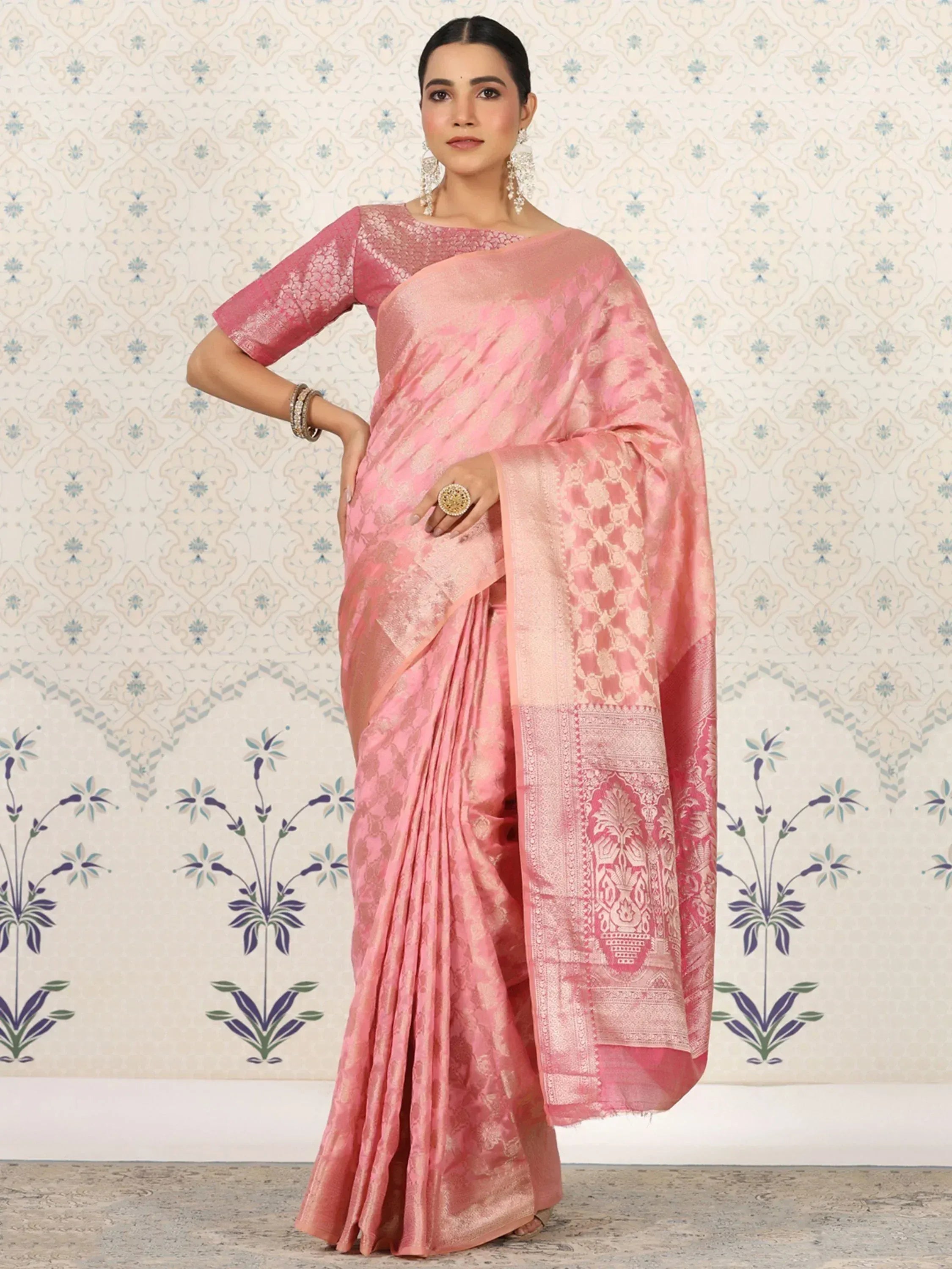Pink designer saree with intricate gold floral patterns and matching blouse, perfect for Indian ethnic wear