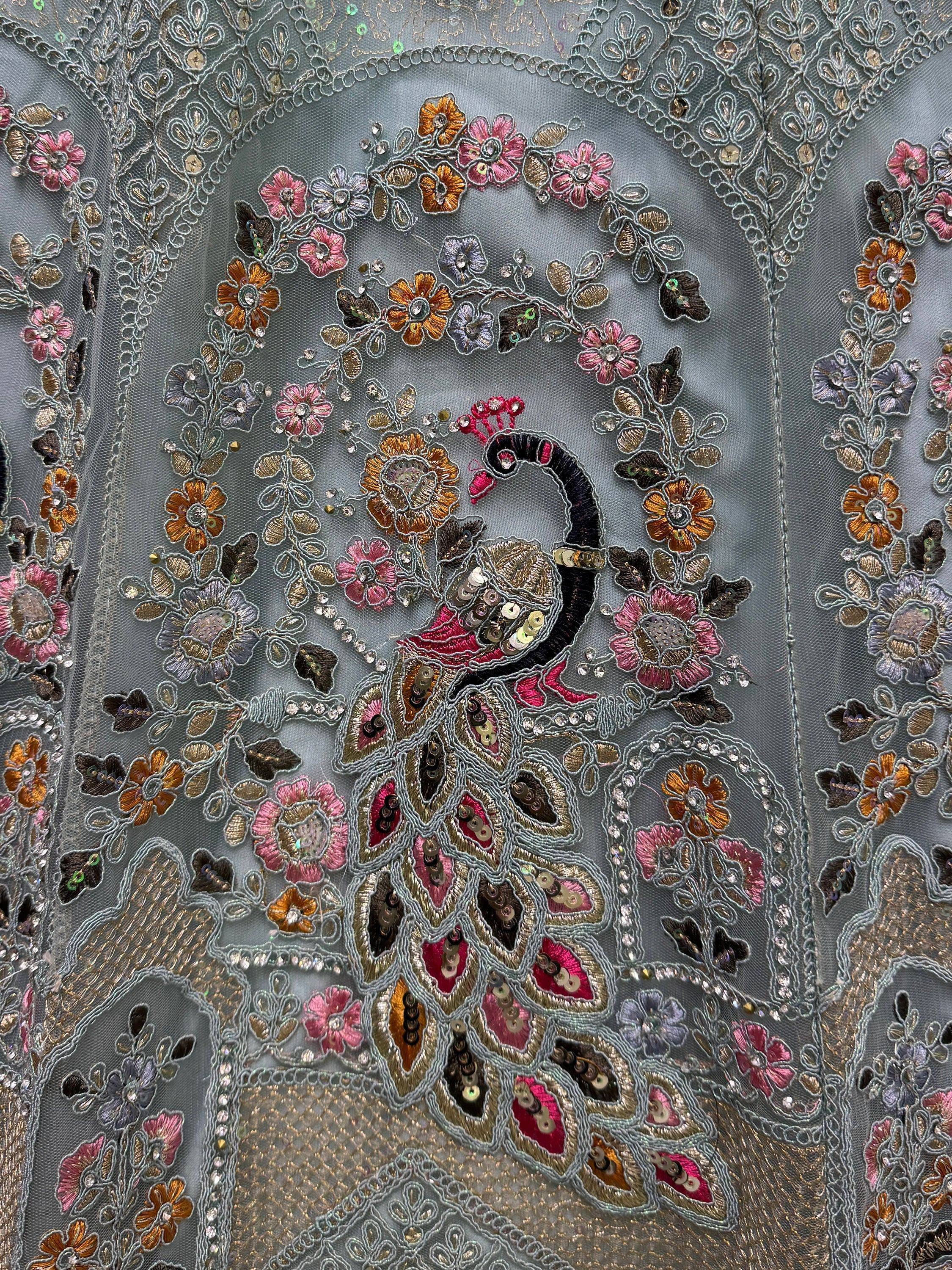 Grey ethnic gown with peacock and floral embroidery, sequins, and lace detailing
