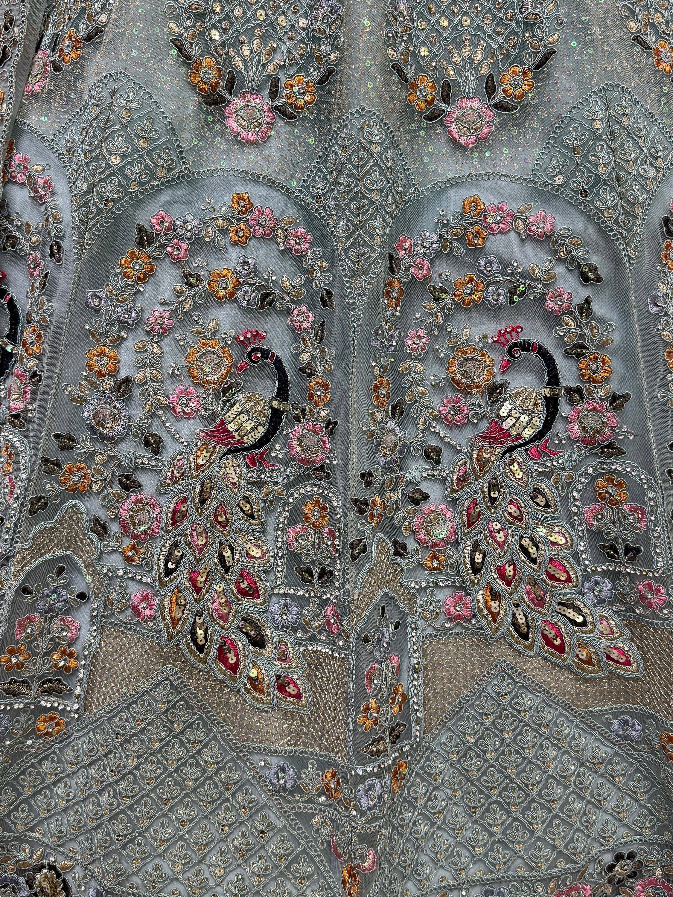 Grey ethnic gown with peacock and floral embroidery, sequins, and beadwork for Indian wear