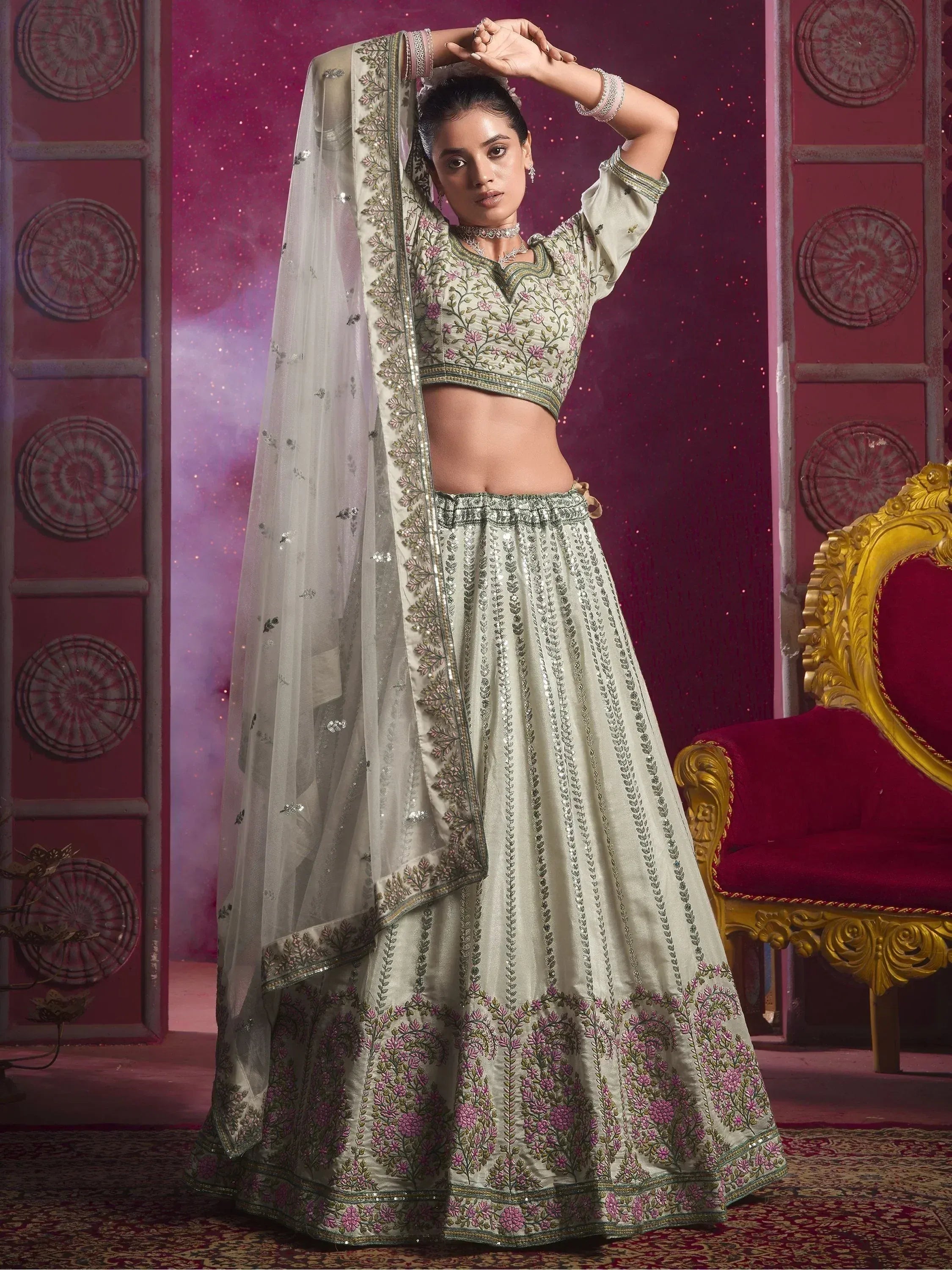 Elegant ivory lehenga choli with floral embroidery and sequin detailing, perfect for Indian weddings and festive occasions.