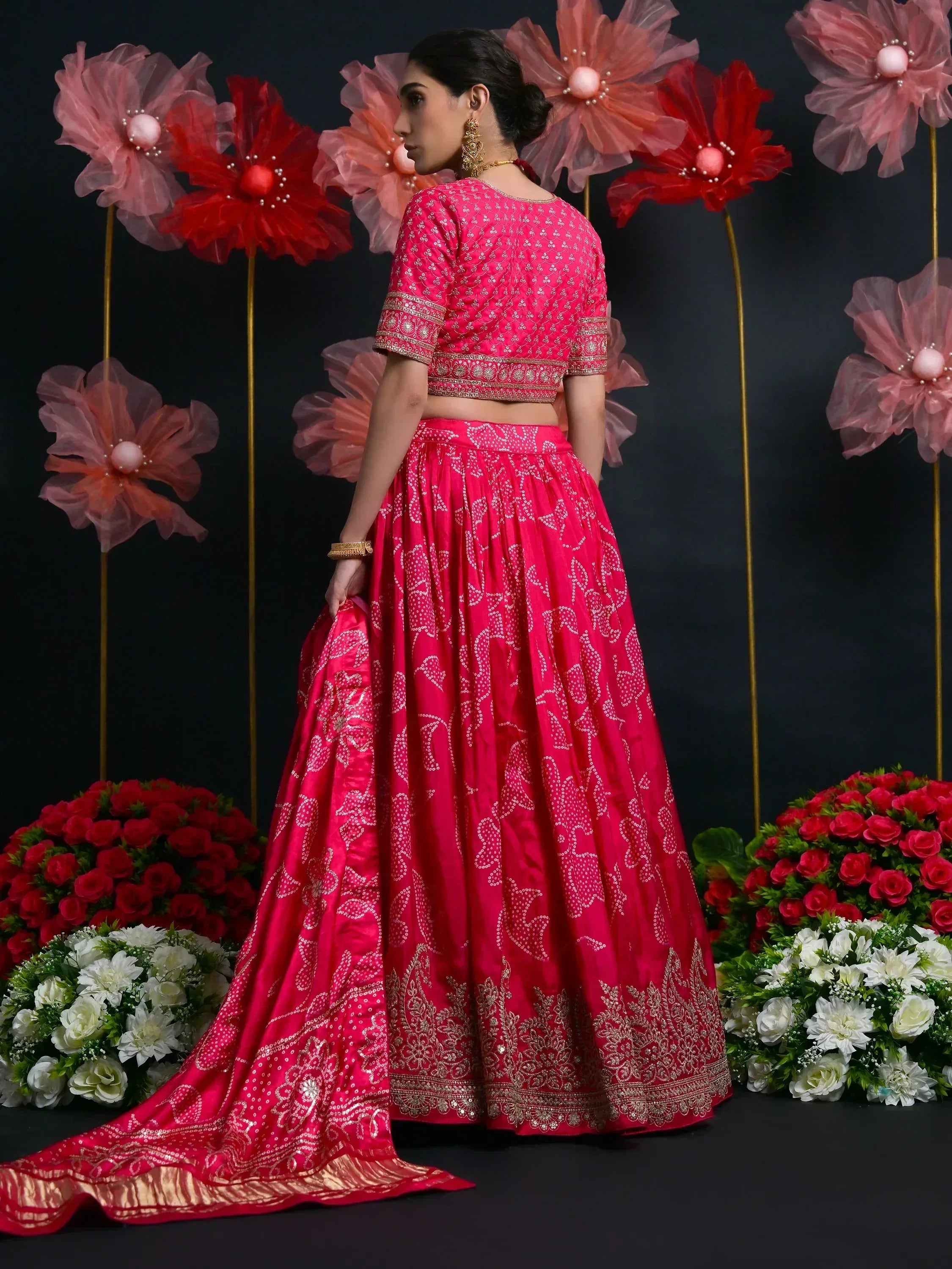 Pink designer lehenga choli with gold embroidery, perfect for Indian weddings and festive occasions