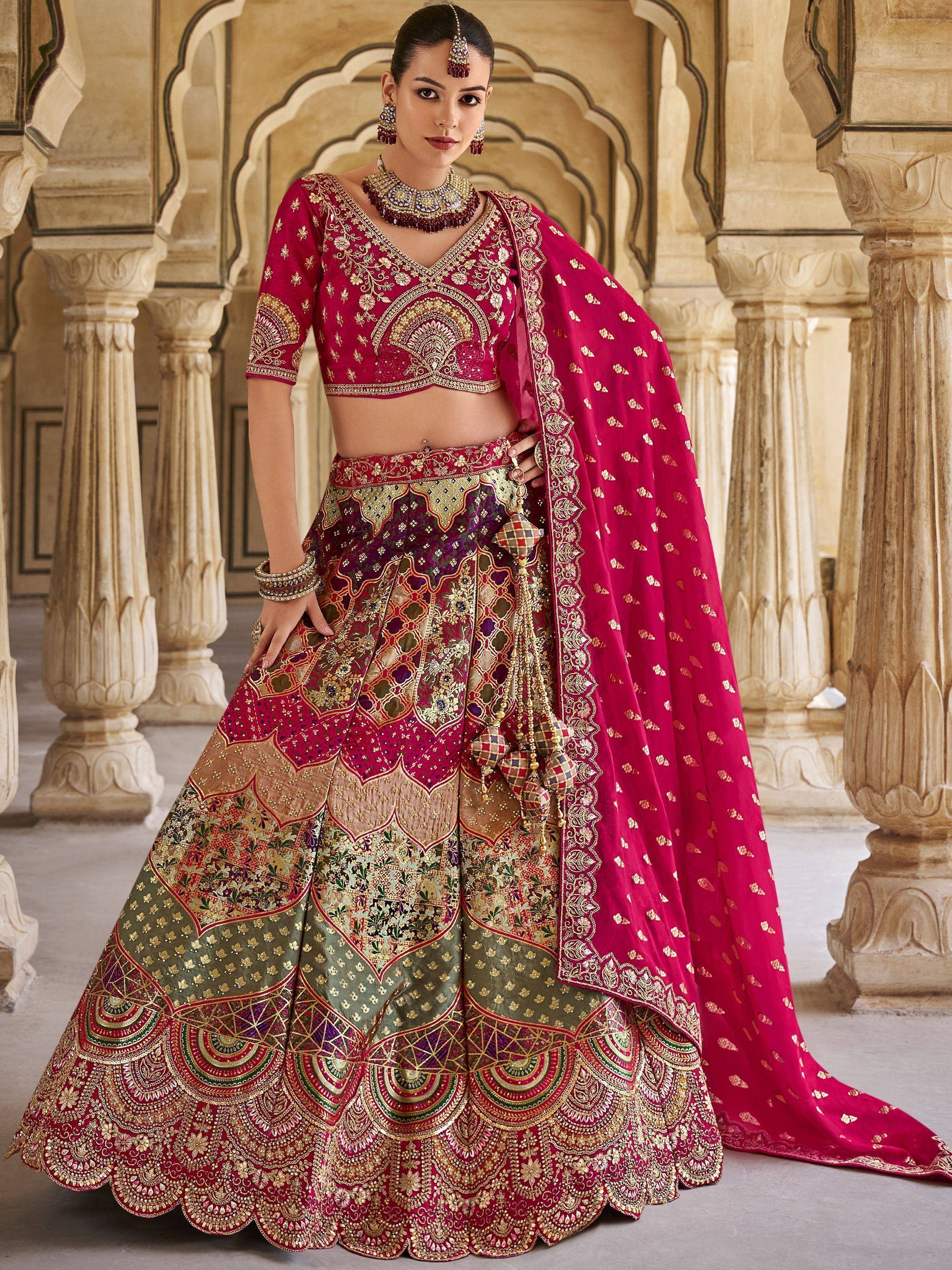 Luxury red and gold embroidered lehenga choli with dupatta, perfect for Indian weddings and festive occasions.