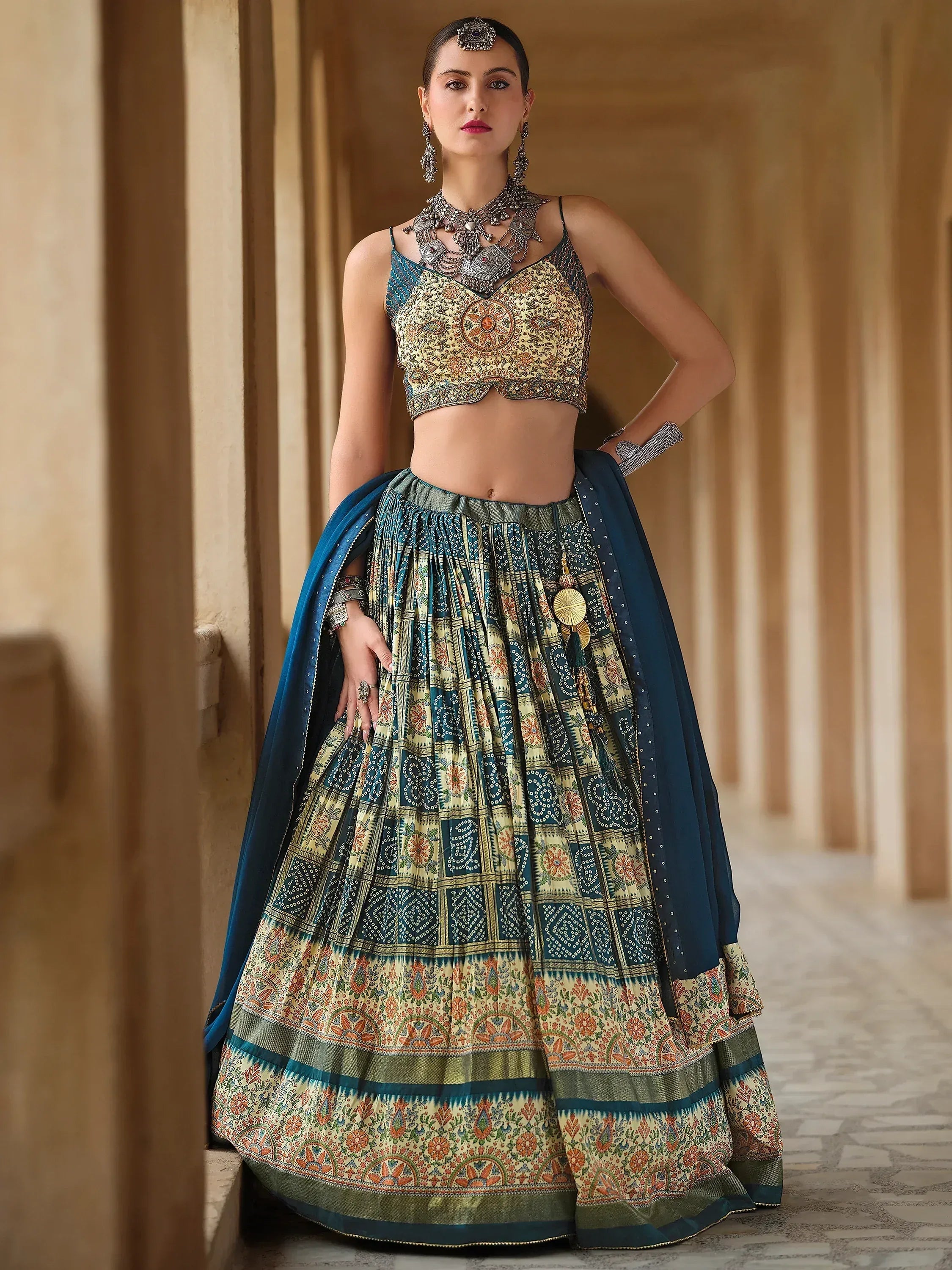 Woman in designer lehenga choli with intricate prints and embroidery, perfect for Indian ethnic wear