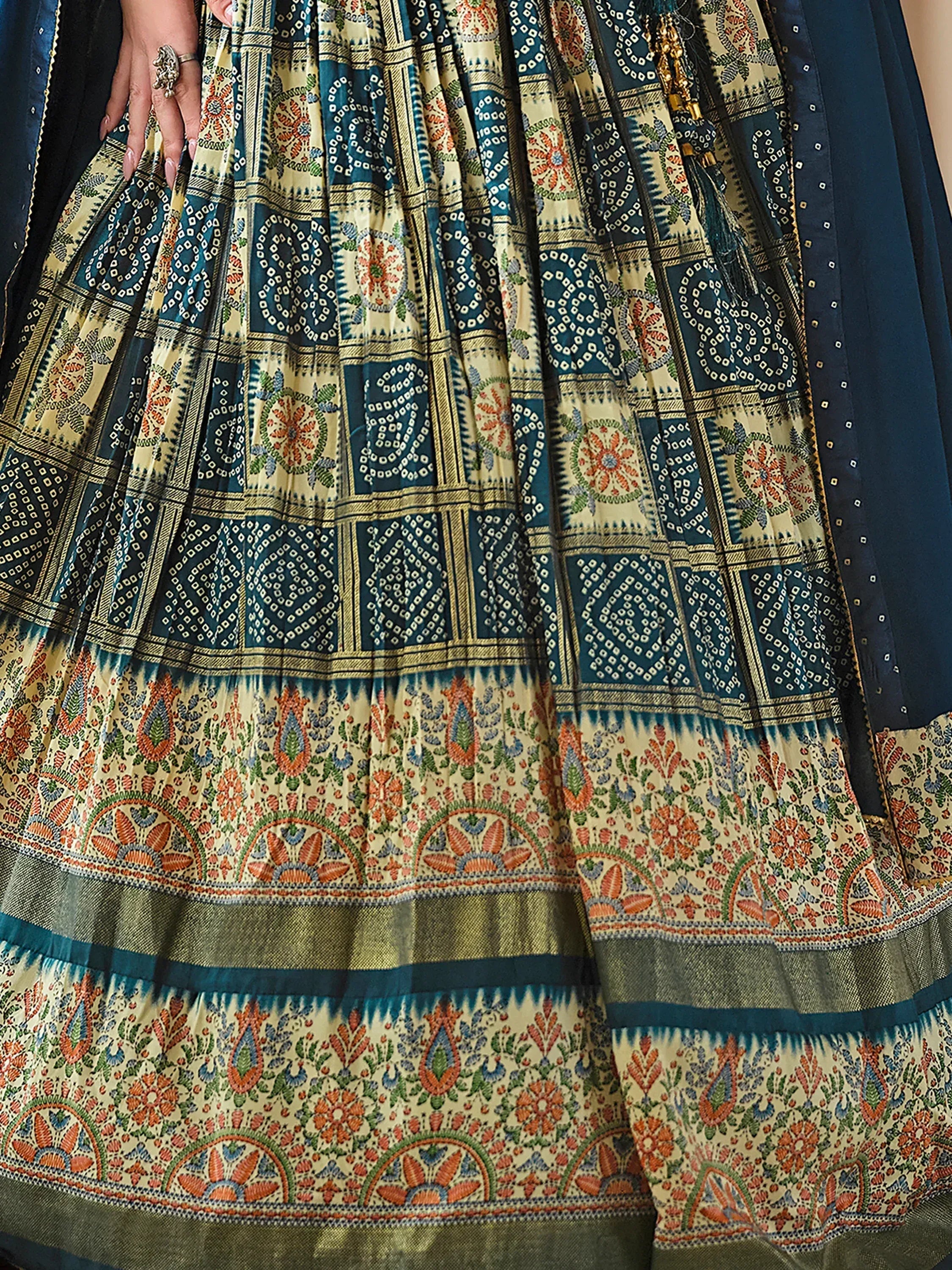 Blue and cream printed lehenga with intricate floral and geometric patterns, perfect for Indian ethnic wear.