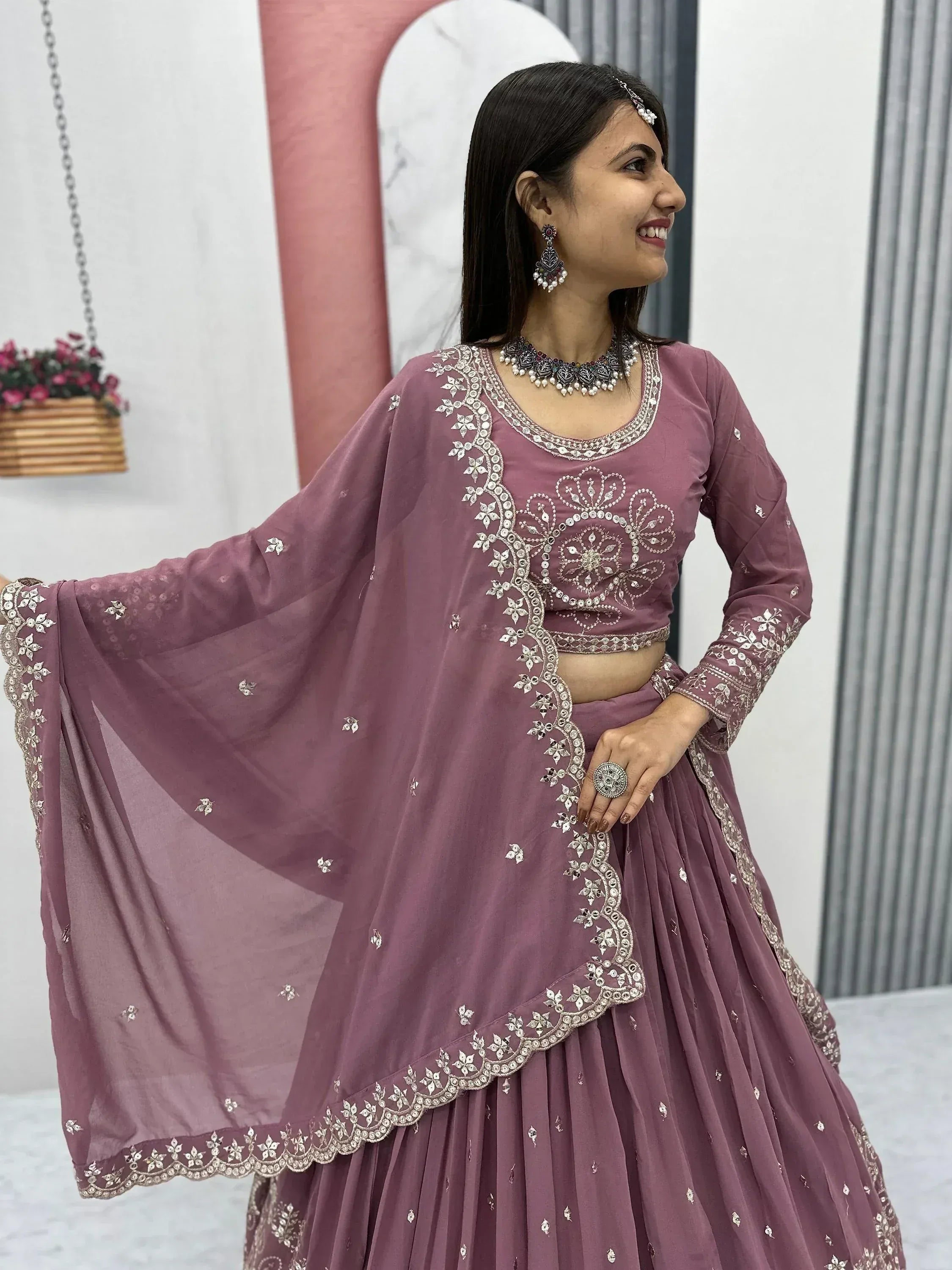 Dusty pink embroidered lehenga choli with mirror work, perfect for Indian ethnic wear occasions
