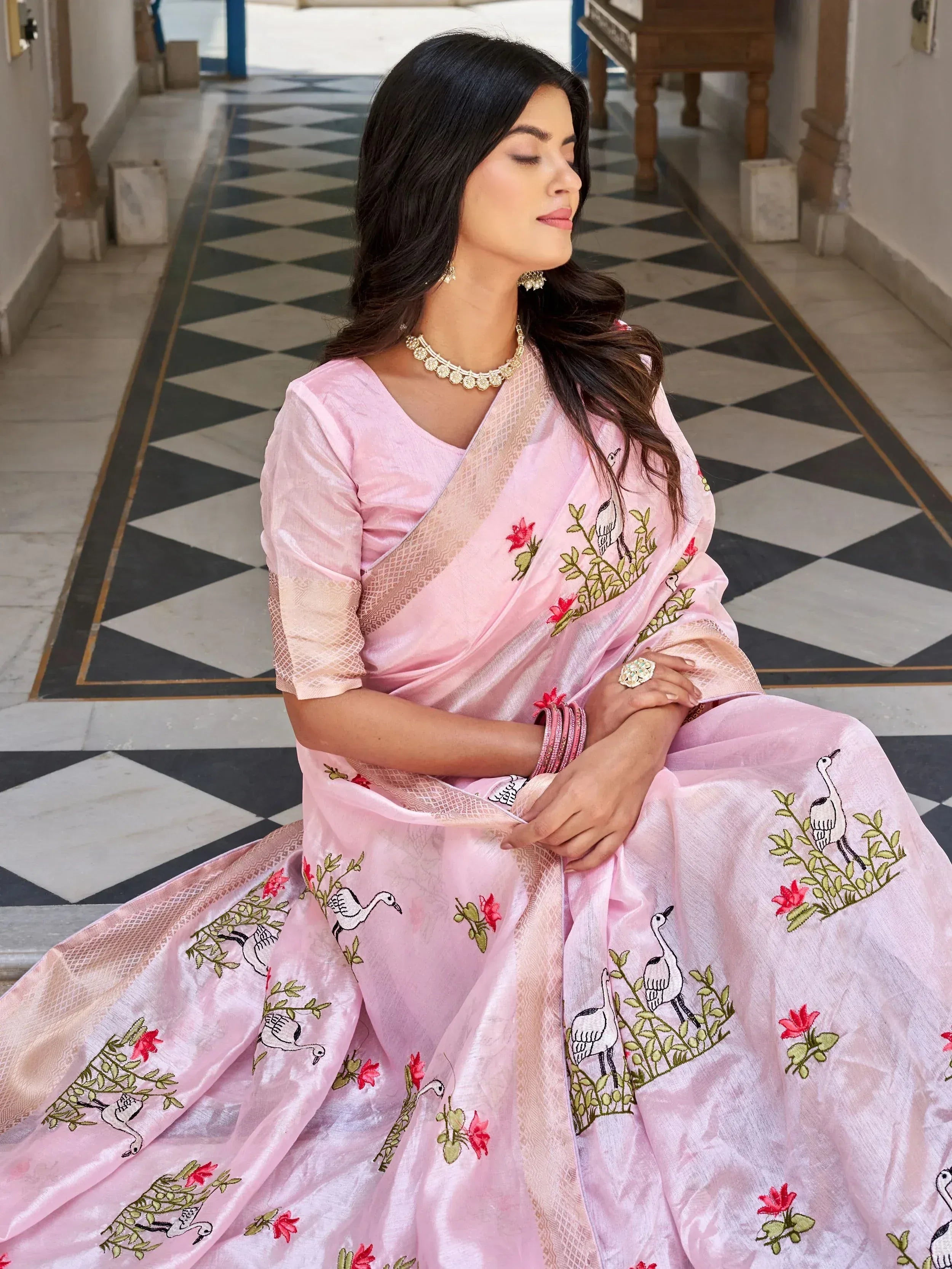 Pink embroidered saree with bird and floral motifs, traditional Indian ethnic wear