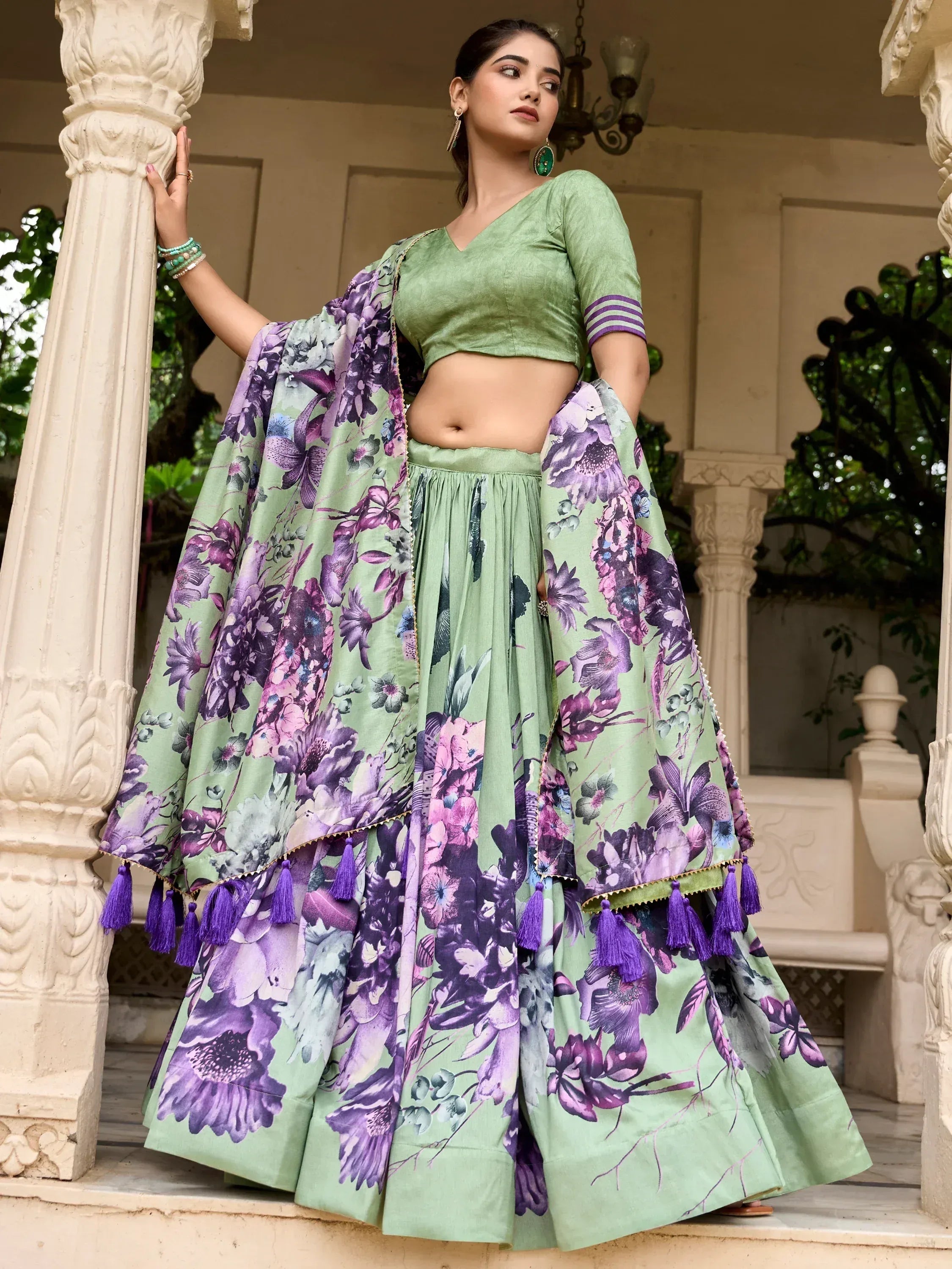 Green floral lehenga choli with purple tassels, perfect for Indian ethnic wear occasions