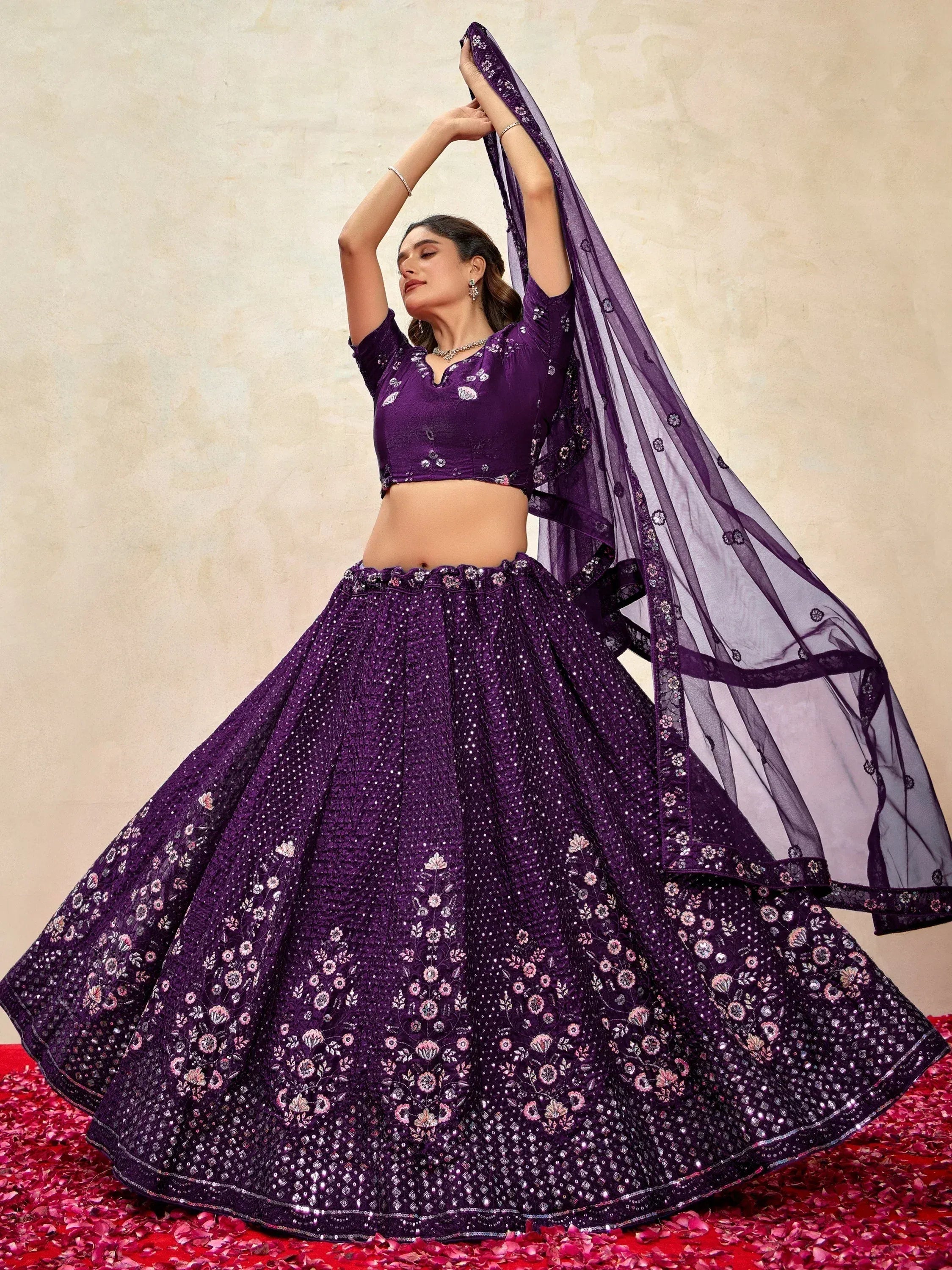 Purple embroidered lehenga choli with floral motifs and sheer dupatta, ideal for Indian ethnic occasions