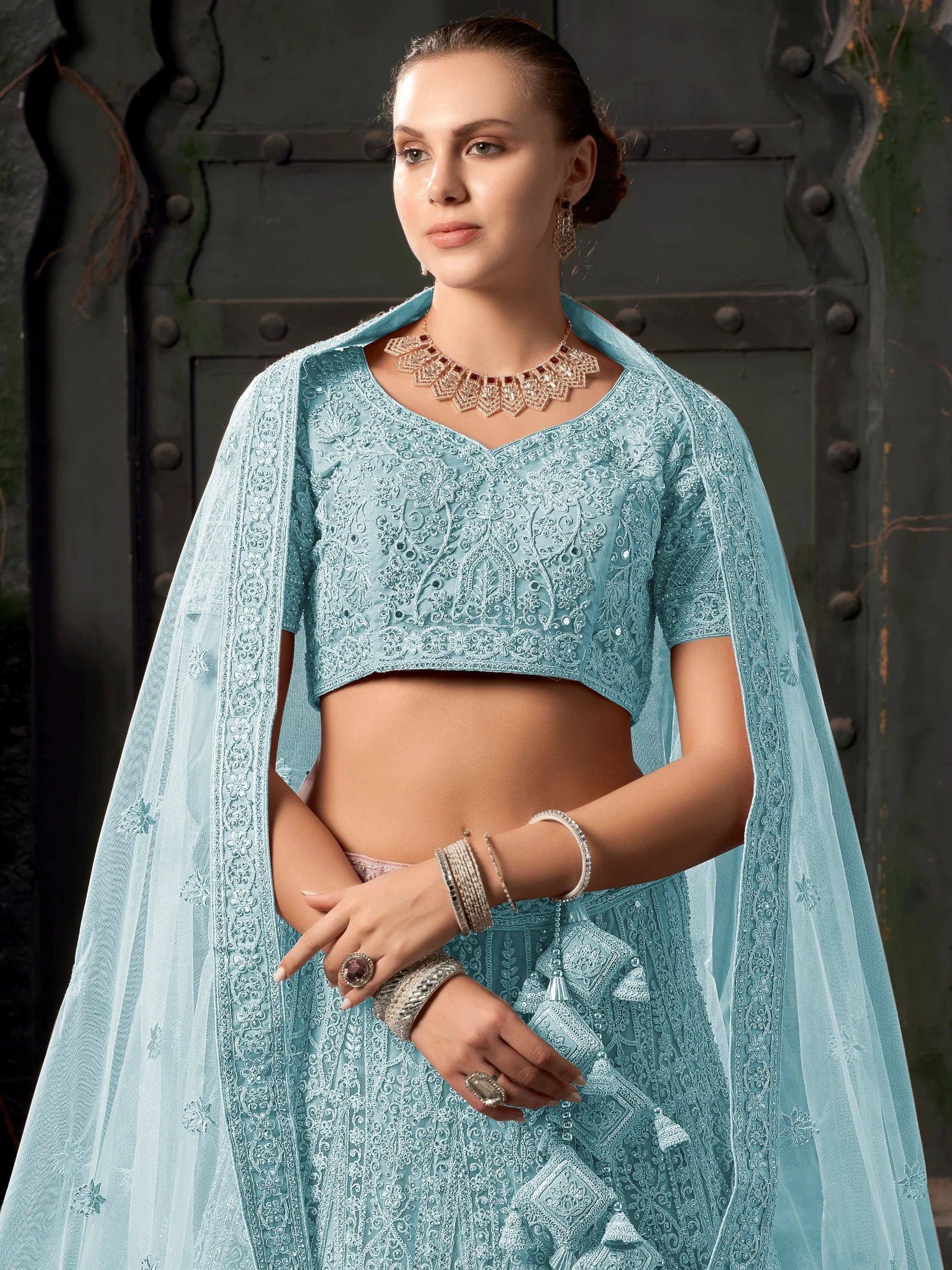 Light blue embroidered lehenga choli with sheer dupatta, perfect for Indian ethnic occasions and weddings.