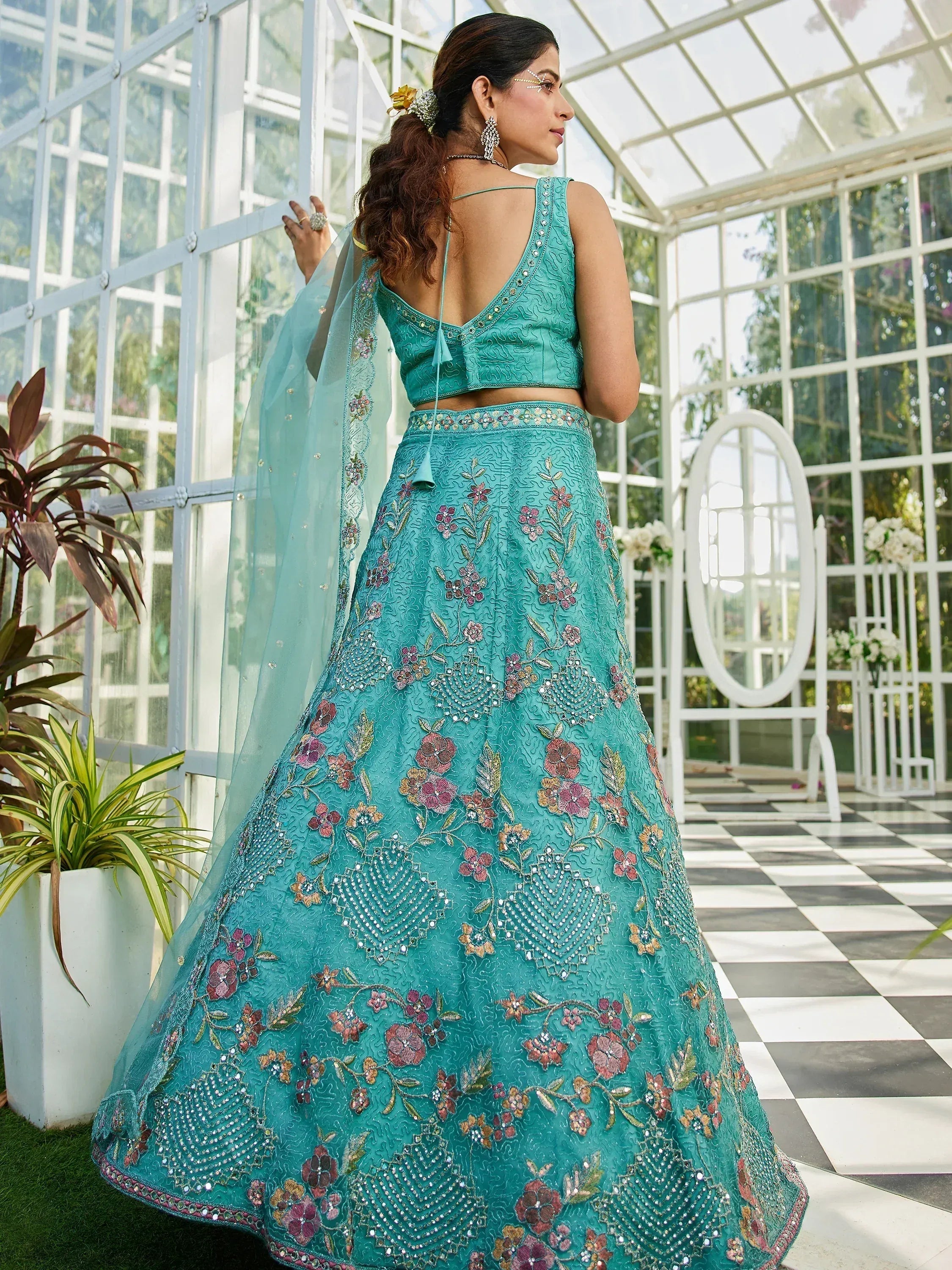 Teal embroidered lehenga choli with floral motifs, perfect for Indian ethnic wear occasions