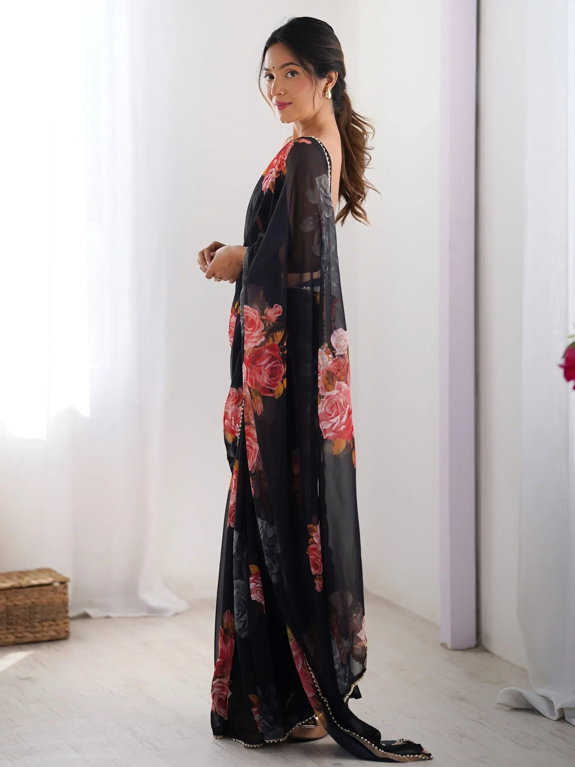 Black floral printed ethnic gown with sheer sleeves and pearl trim, perfect for Indian occasions