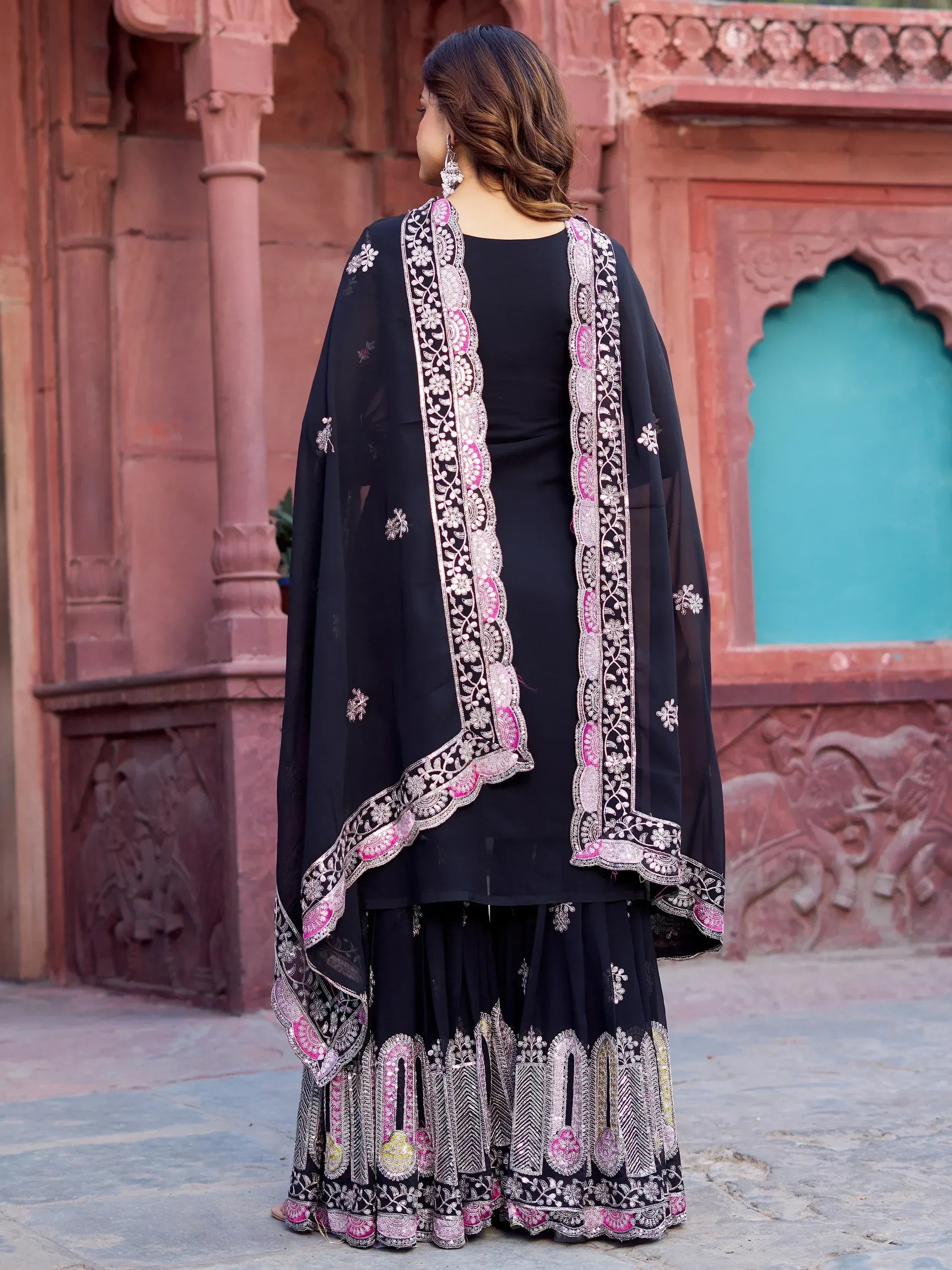 Black embroidered ethnic salwar kameez with pink and silver detailing, perfect for Indian wear