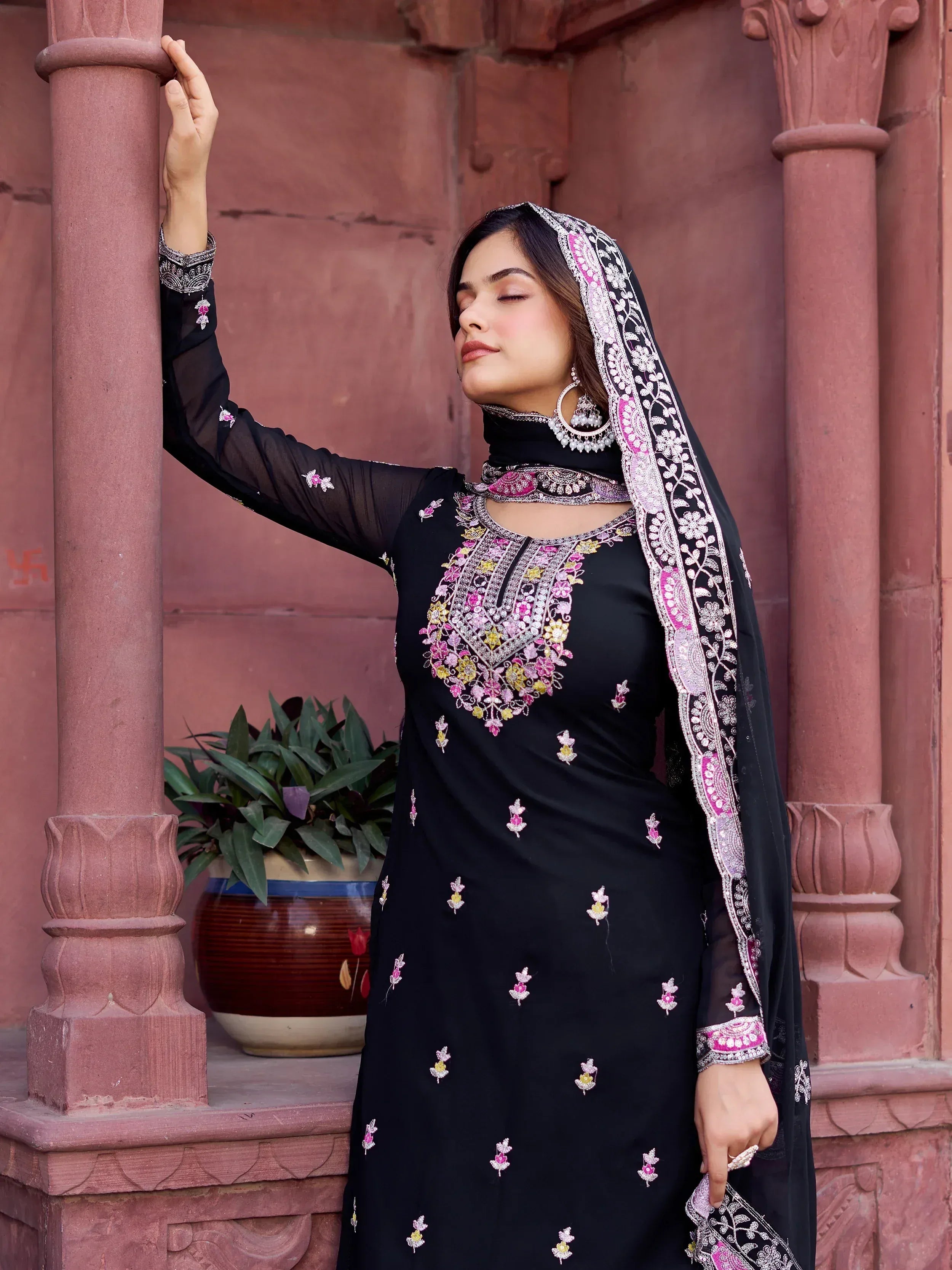 Black embroidered salwar kameez with floral embellishments and matching dupatta, perfect for Indian ethnic wear