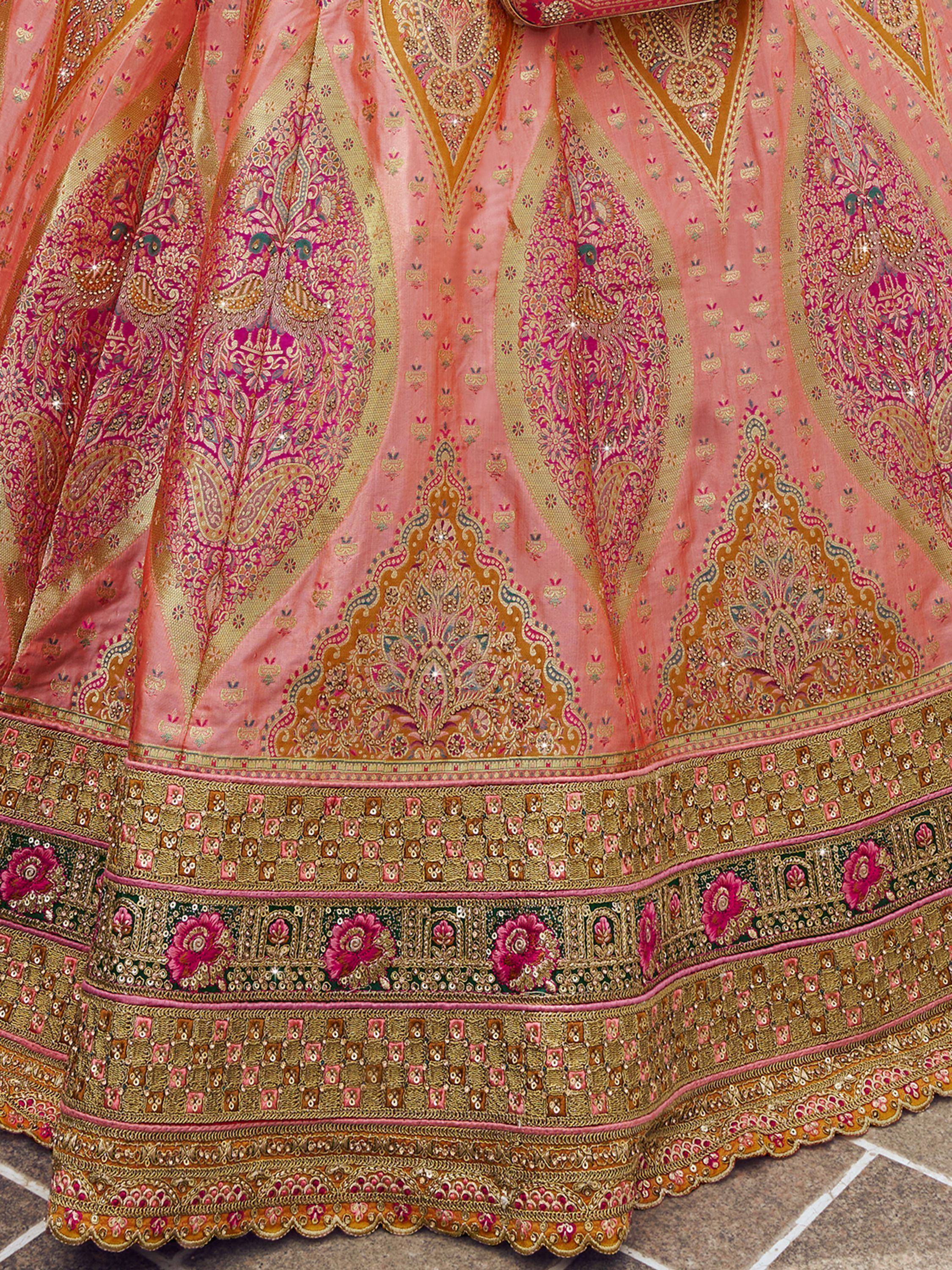 Pink and gold designer lehenga with intricate embroidery and floral border, ethnic Indian wear