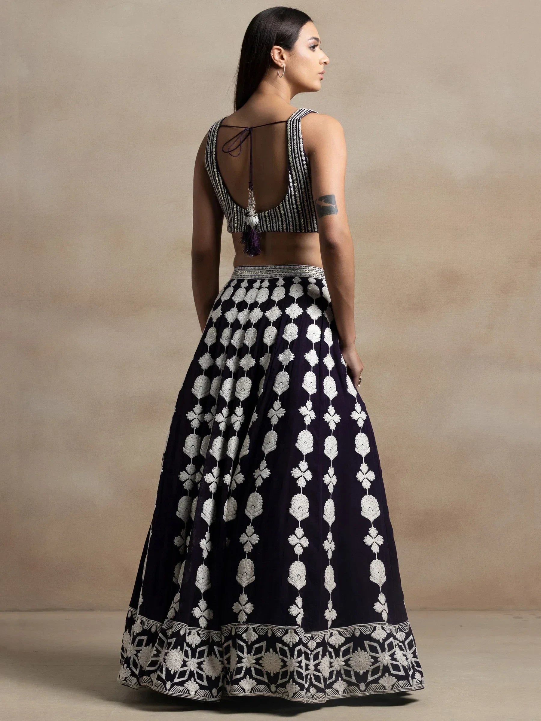 Navy blue lehenga choli with white floral embroidery, back view, ethnic wear for women
