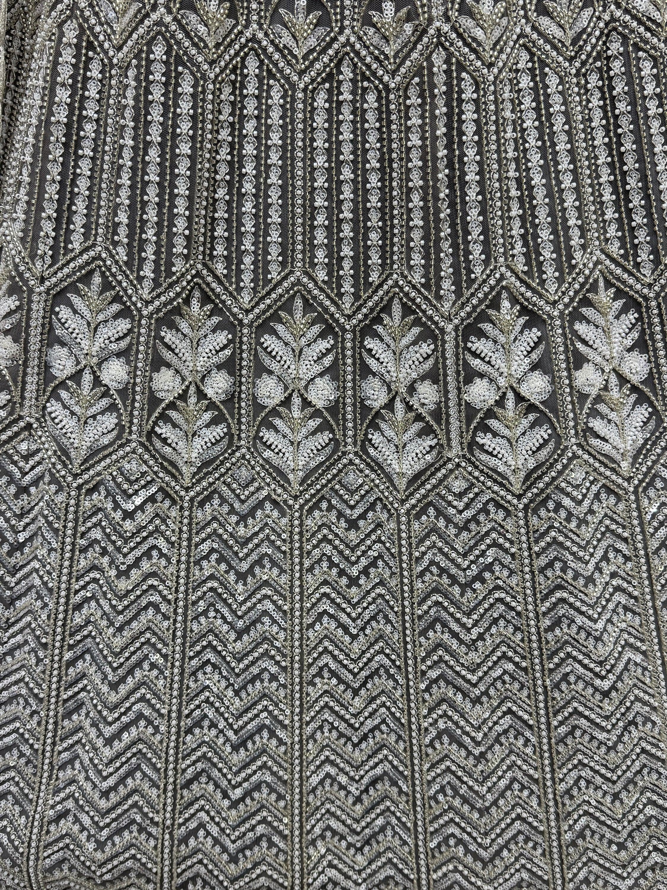 Exquisite silver sequin and bead embroidery on black net fabric, perfect for designer lehenga choli or ethnic gown.