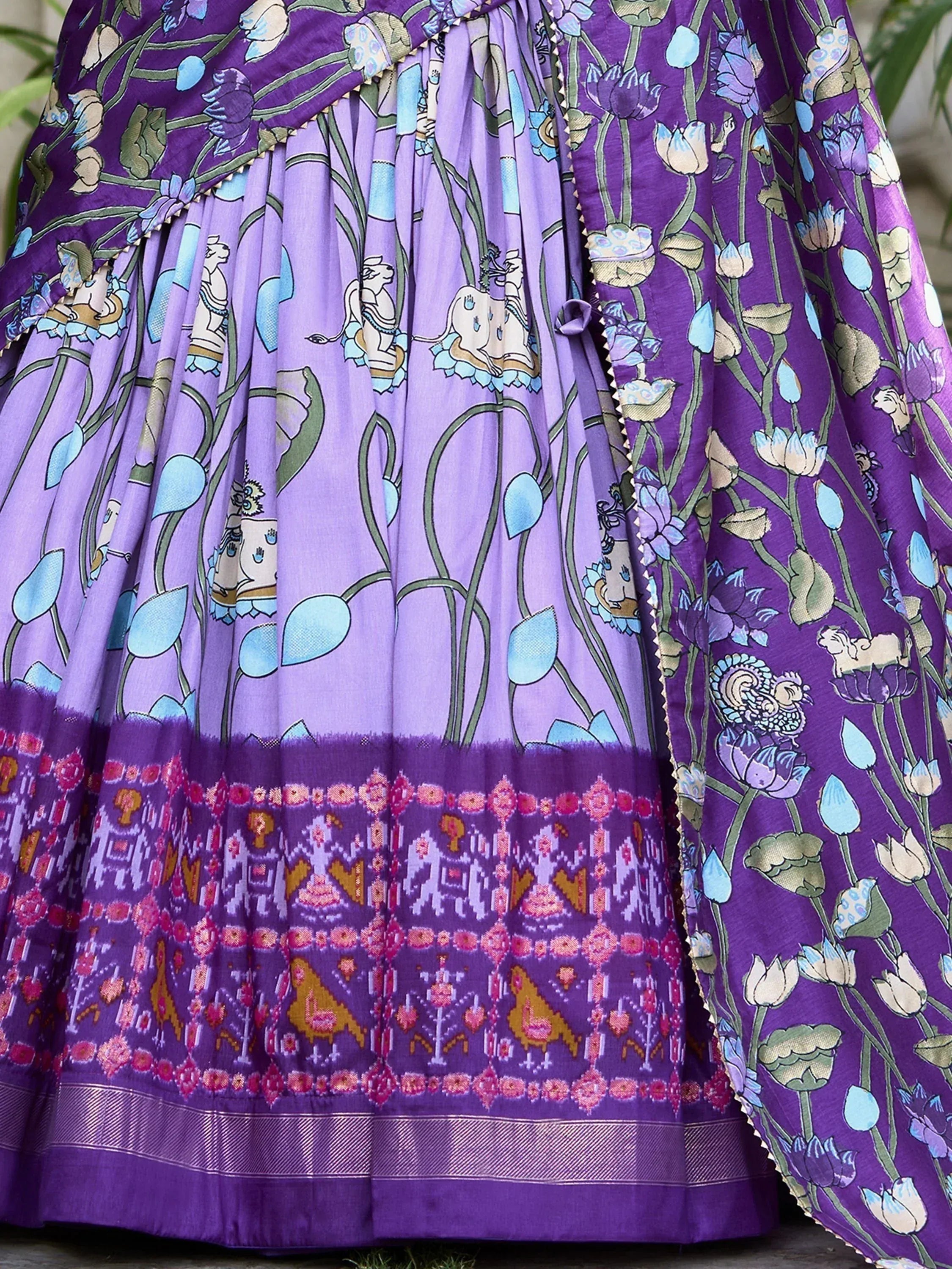Purple floral print lehenga with intricate border, perfect for Indian ethnic wear and festive occasions.