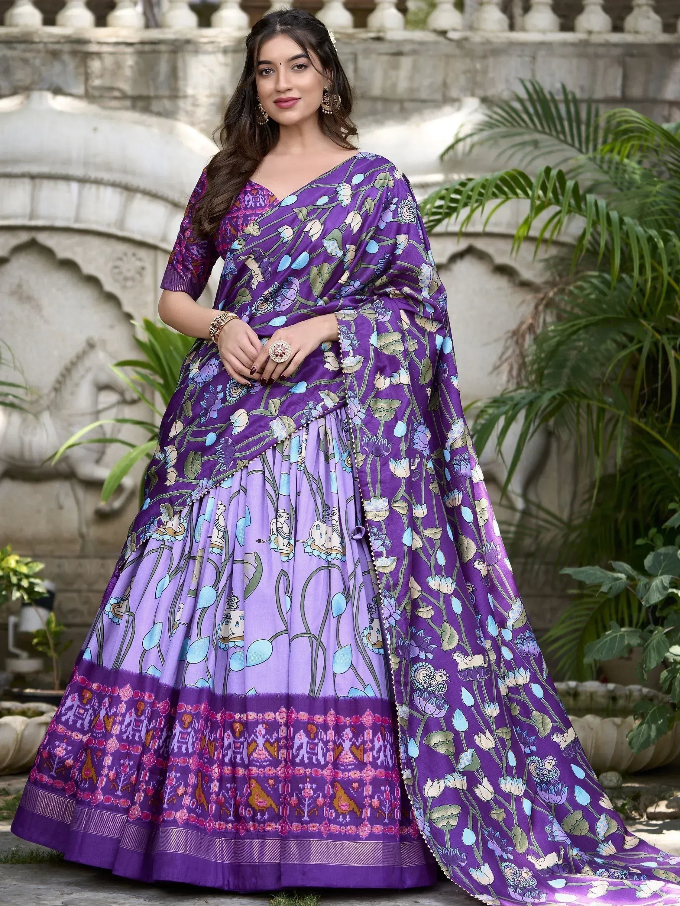 Purple floral print lehenga choli with ethnic motifs, perfect for Indian weddings and festive occasions