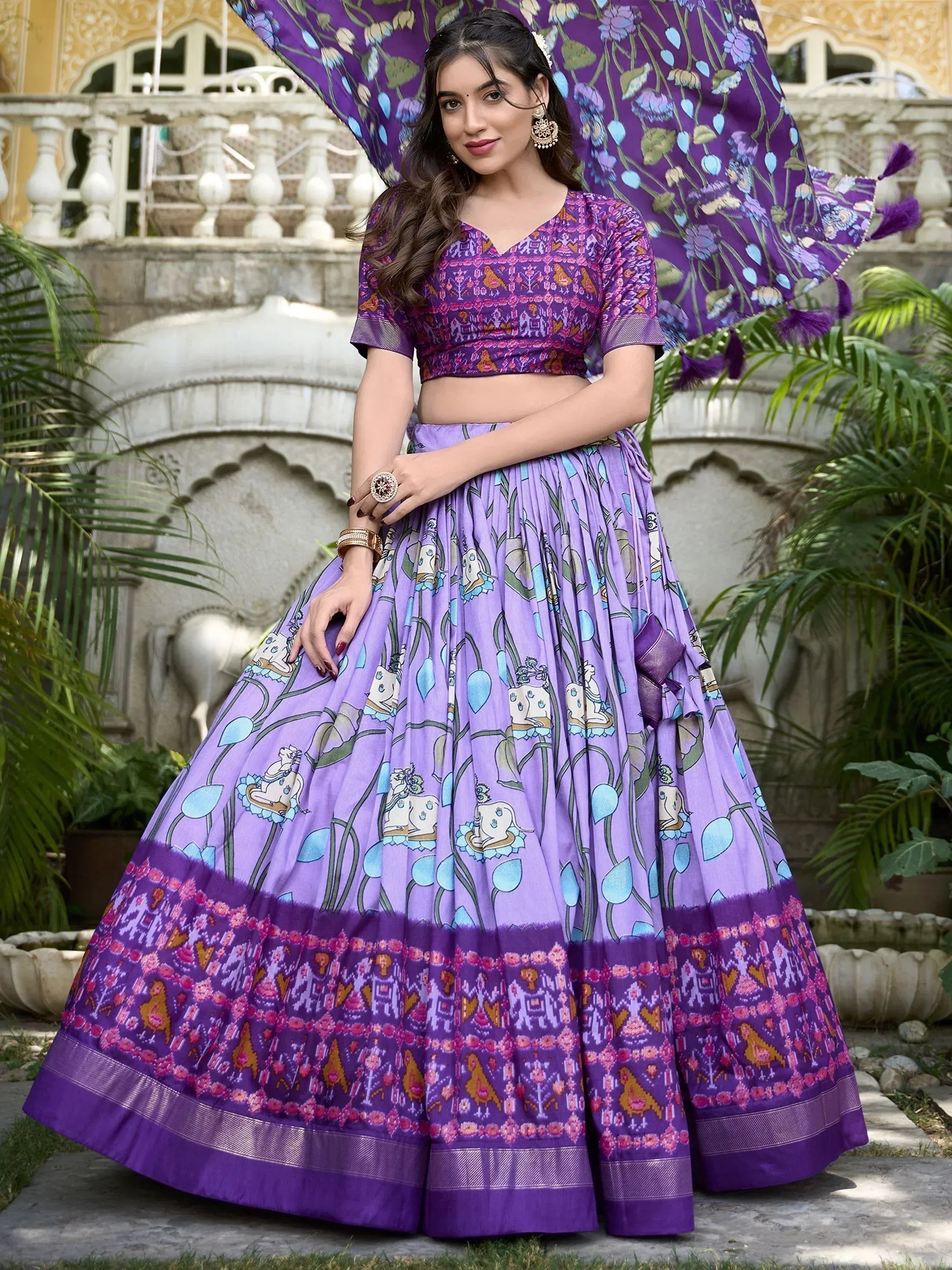 Purple printed lehenga choli with floral and elephant motifs, perfect for Indian ethnic occasions
