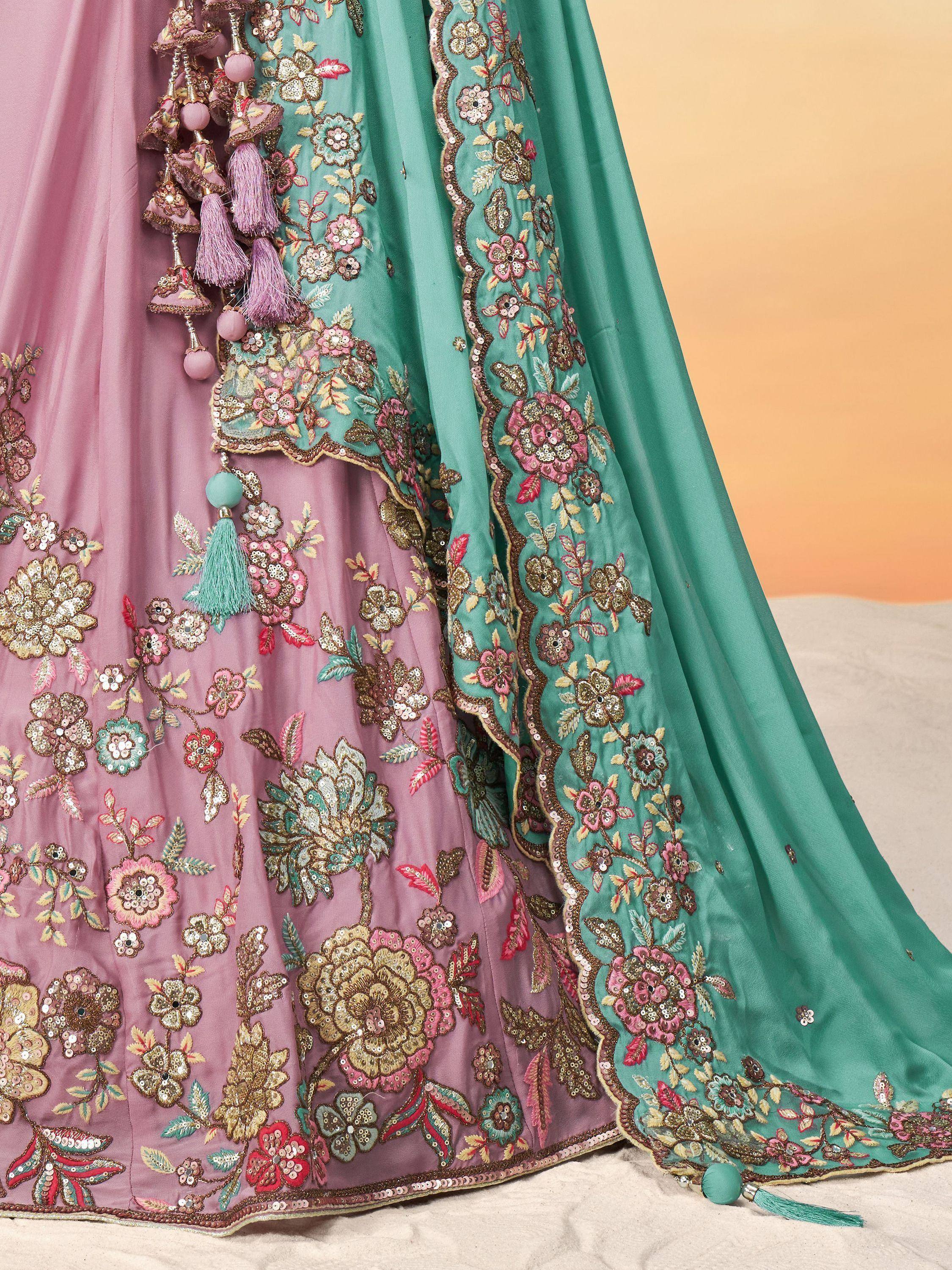 Pink and mint green designer lehenga with floral embroidery, sequins, and tassels for Indian ethnic wear