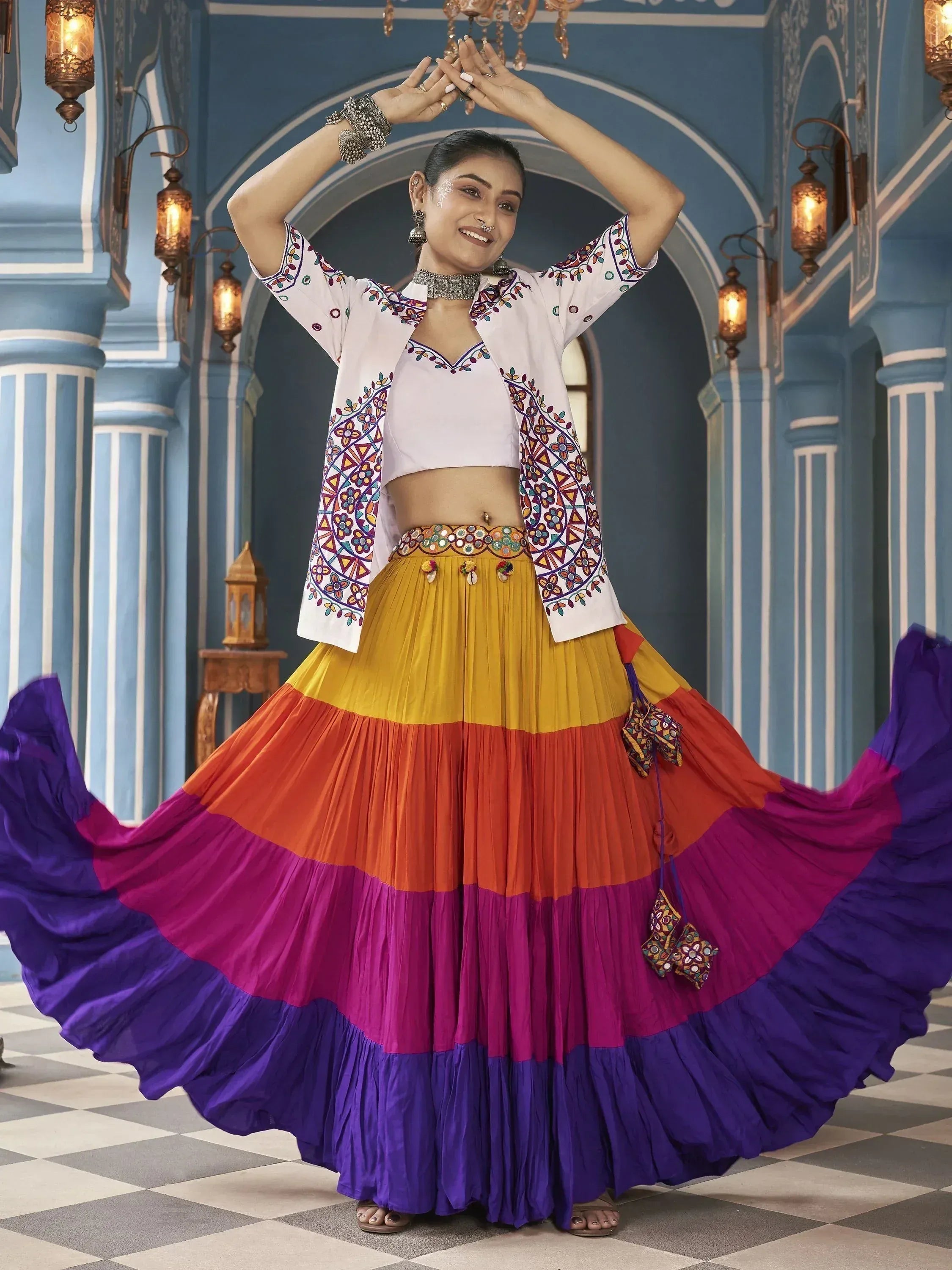 Vibrant multicolor ethnic skirt with embroidered white jacket, perfect for festive occasions