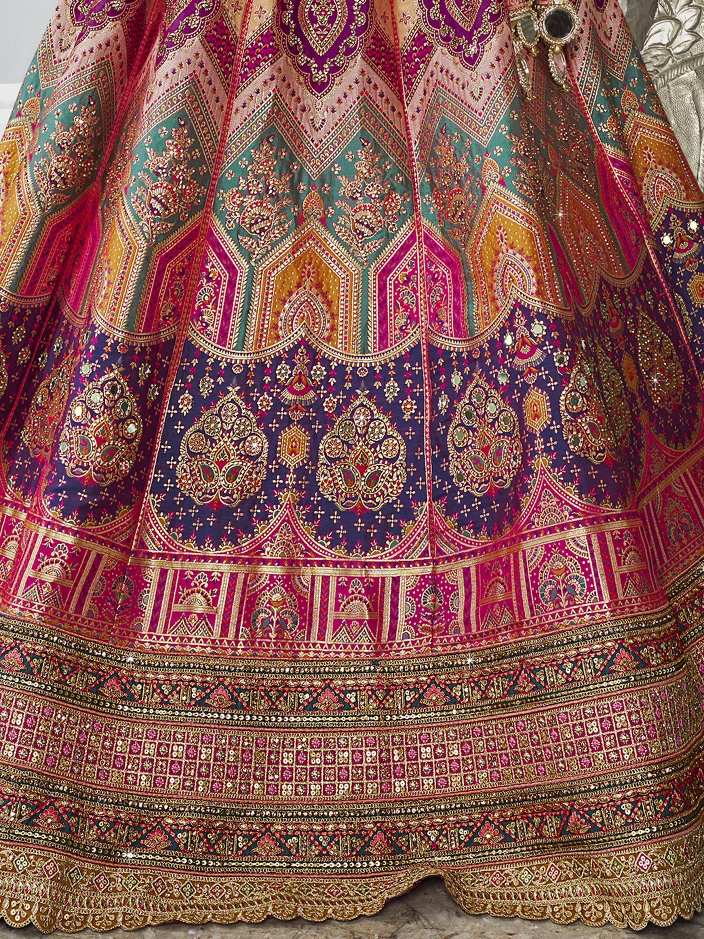Vibrant Indian lehenga with intricate embroidery and mirror work, perfect for weddings and festivals.