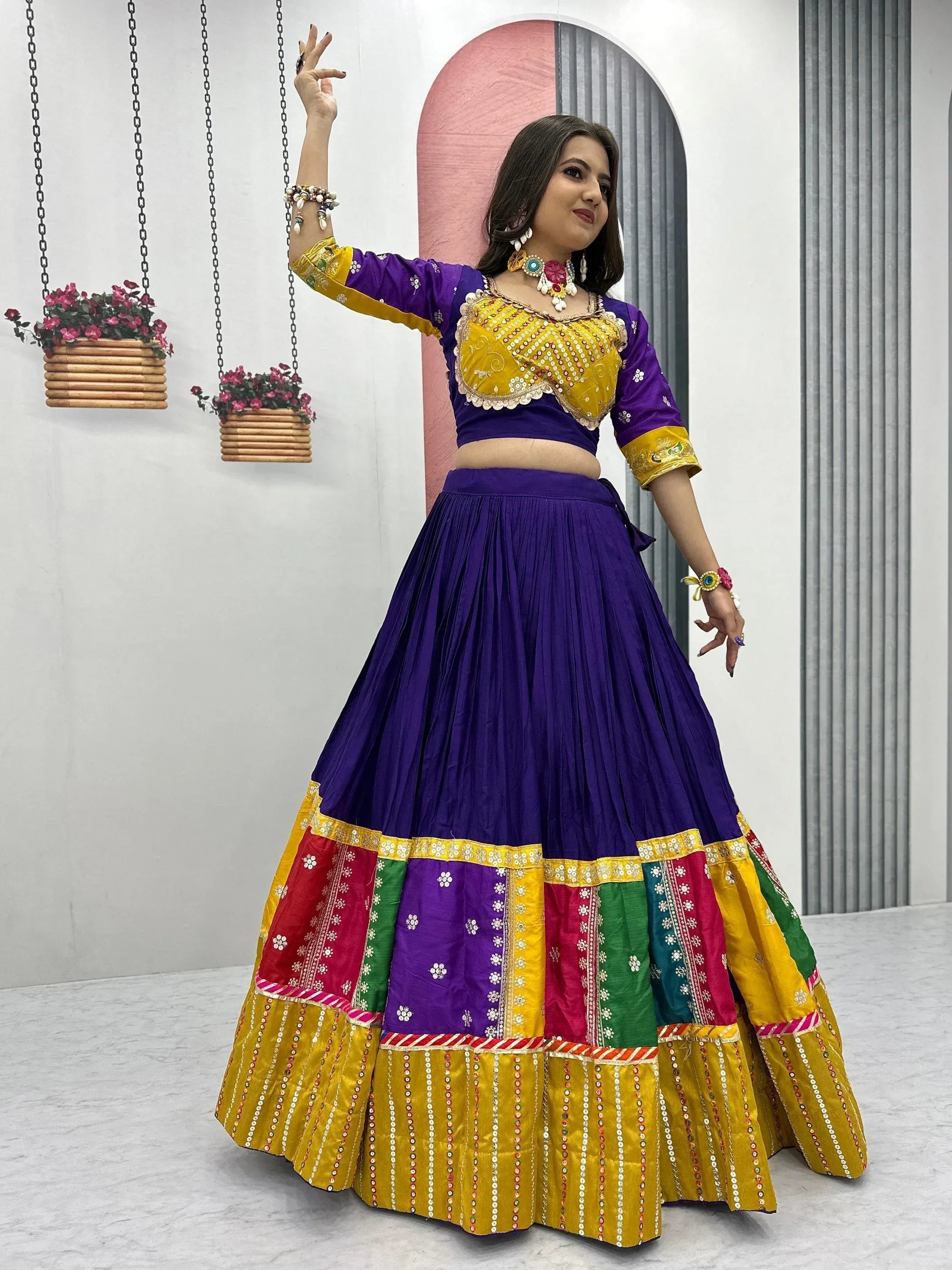 Purple and yellow designer lehenga choli with colorful patchwork skirt, perfect for Indian ethnic wear.