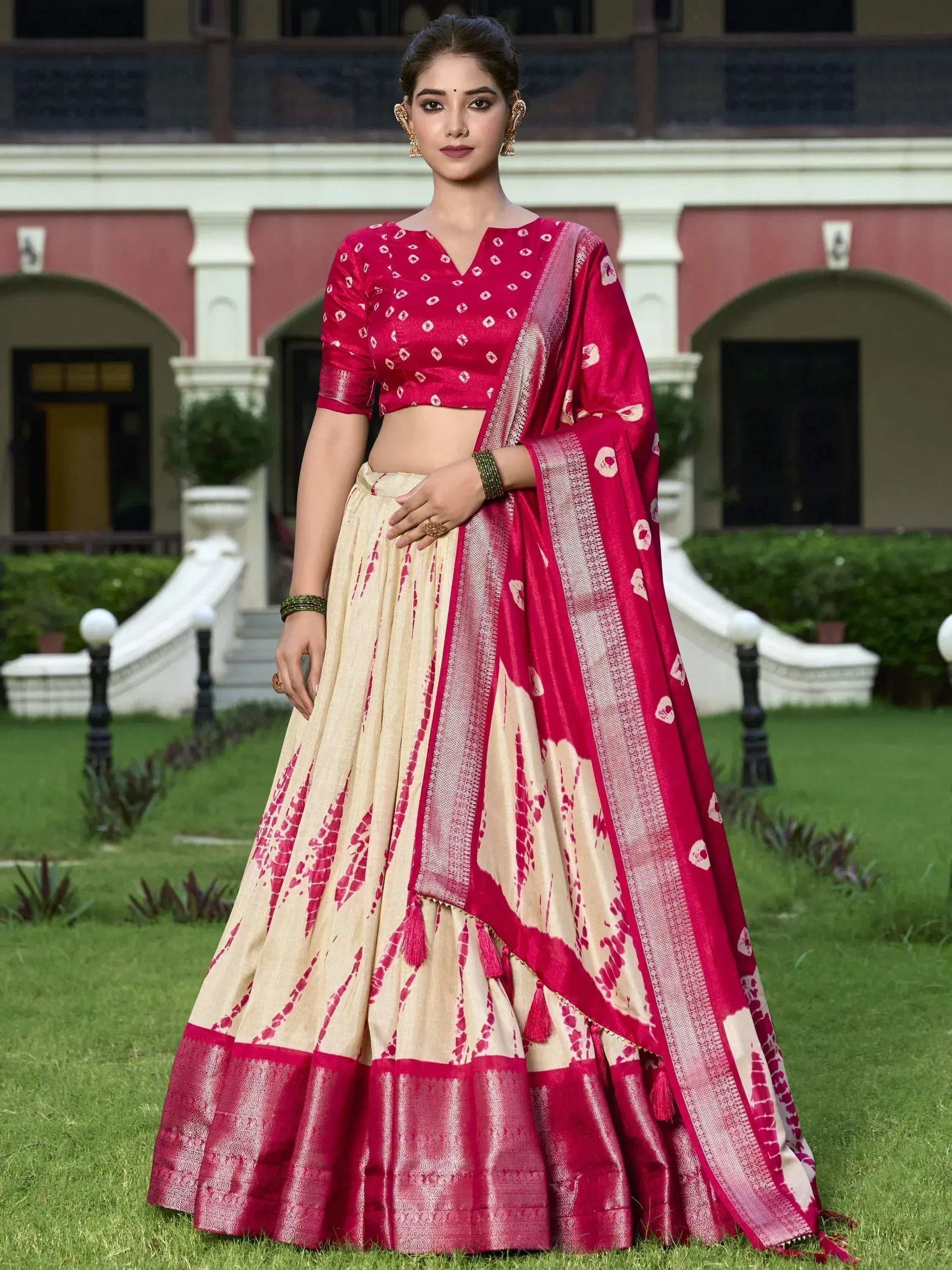 Pink and cream designer lehenga choli with floral print and gold border, perfect for Indian ethnic wear