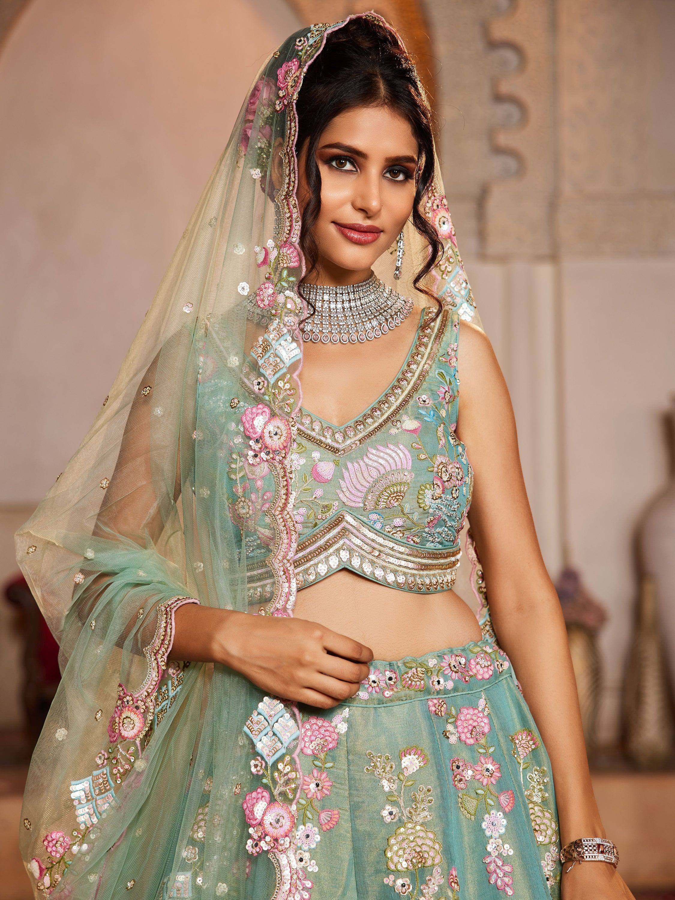 Mint green embroidered lehenga choli with floral motifs and matching dupatta for Indian ethnic wear