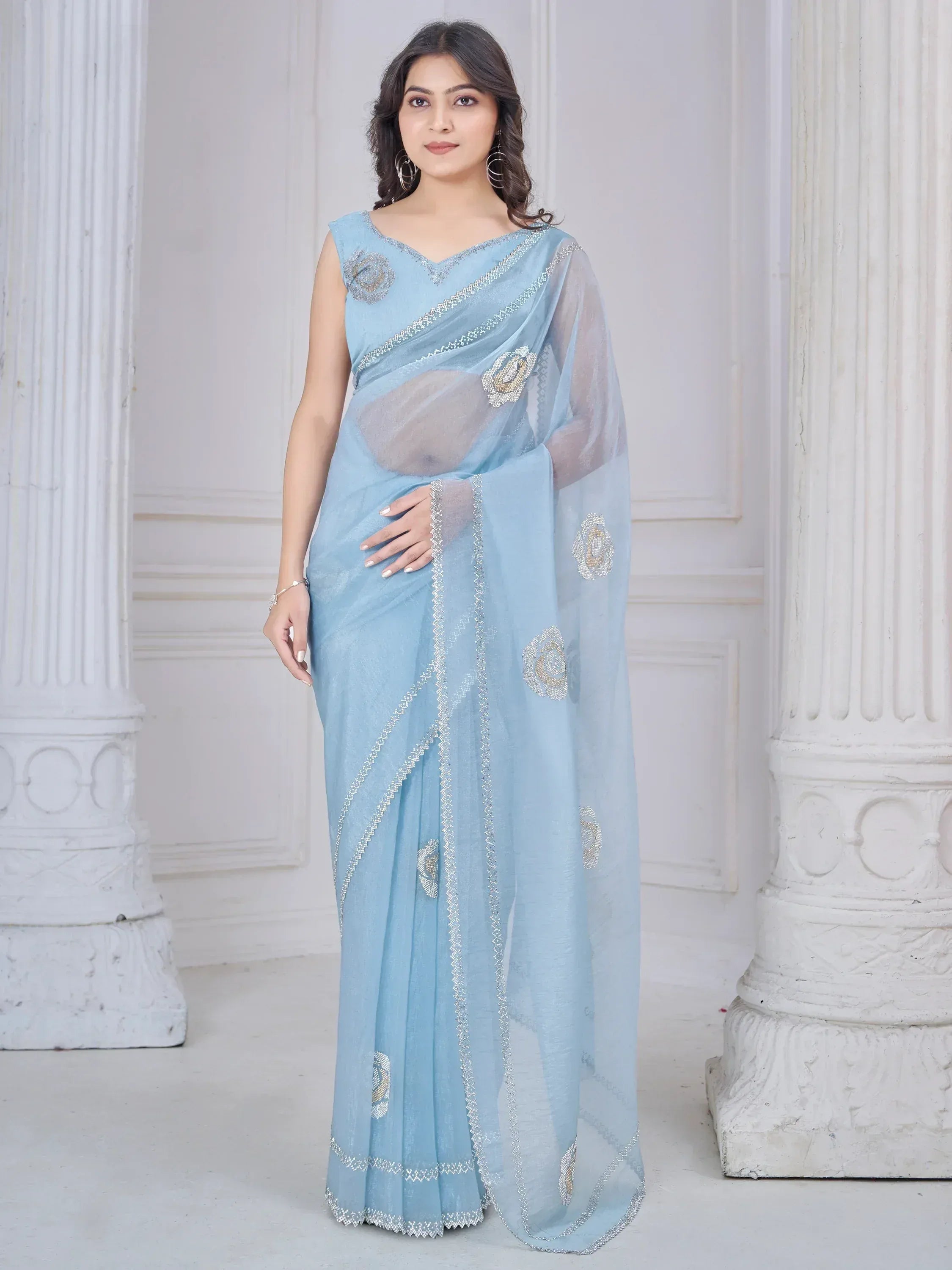 Light blue designer saree with silver embroidery and floral motifs, perfect for ethnic occasions