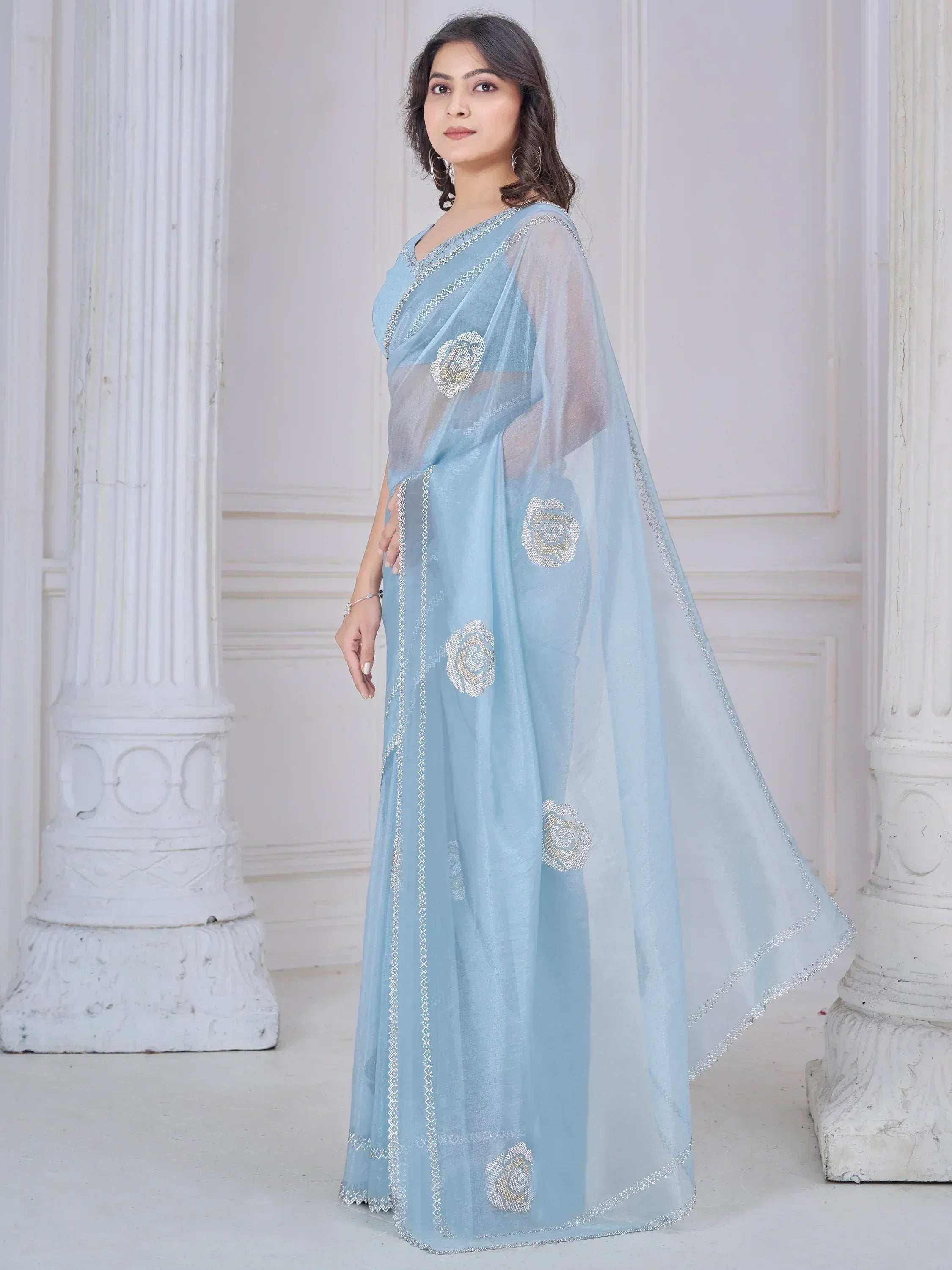 Light blue saree with floral embroidery and silver border, elegant Indian ethnic wear for women