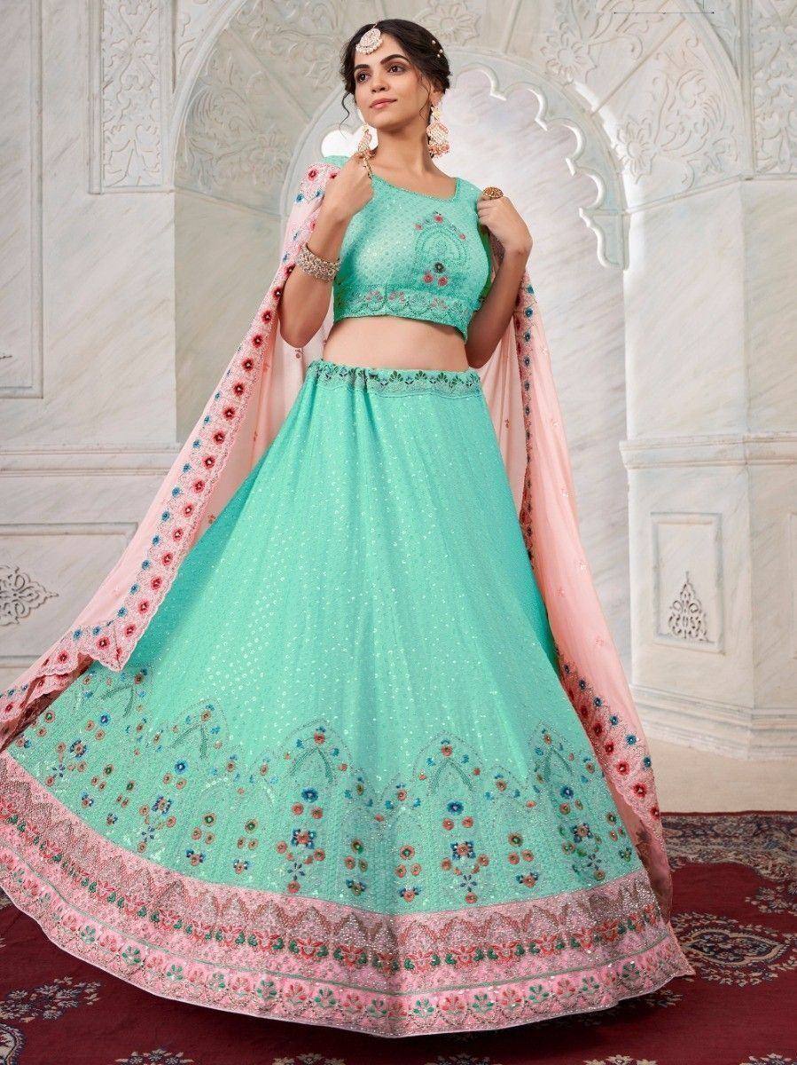 Mint green embroidered lehenga choli with pink dupatta, perfect for Indian weddings and festive occasions