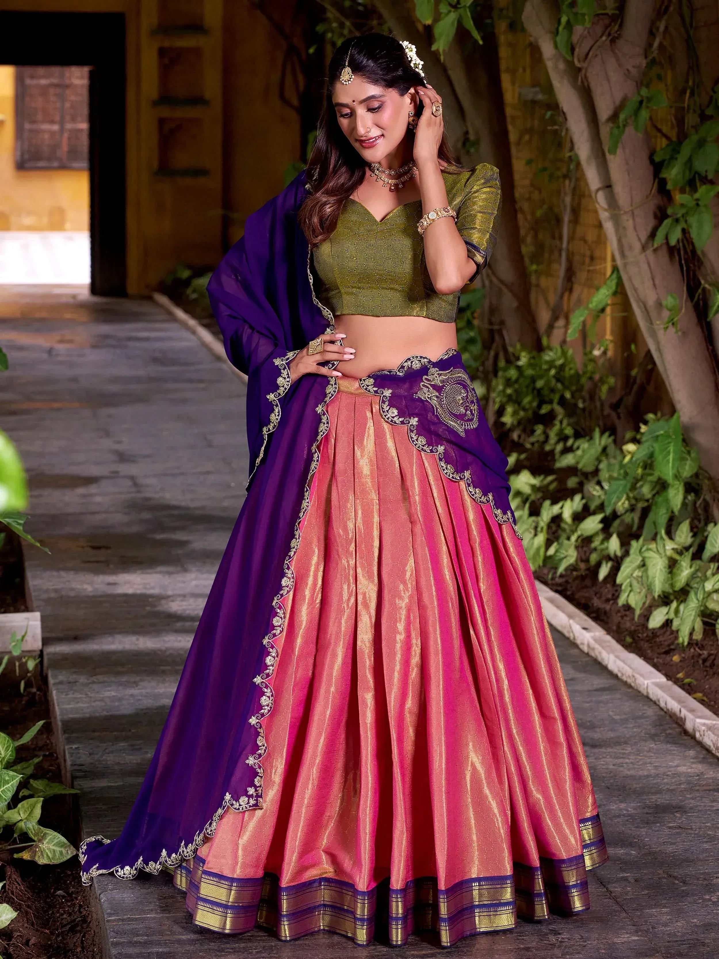Elegant pink and purple lehenga choli with gold embroidery, perfect for Indian ethnic wear