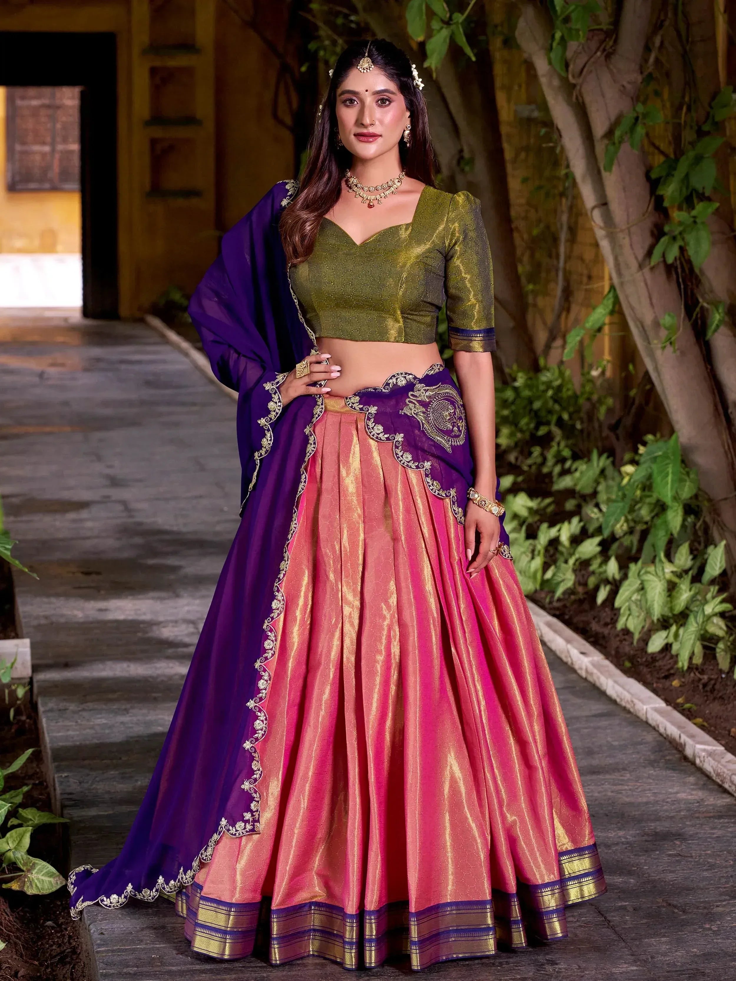 Elegant purple and pink lehenga choli with gold embroidery, perfect for Indian ethnic wear occasions.